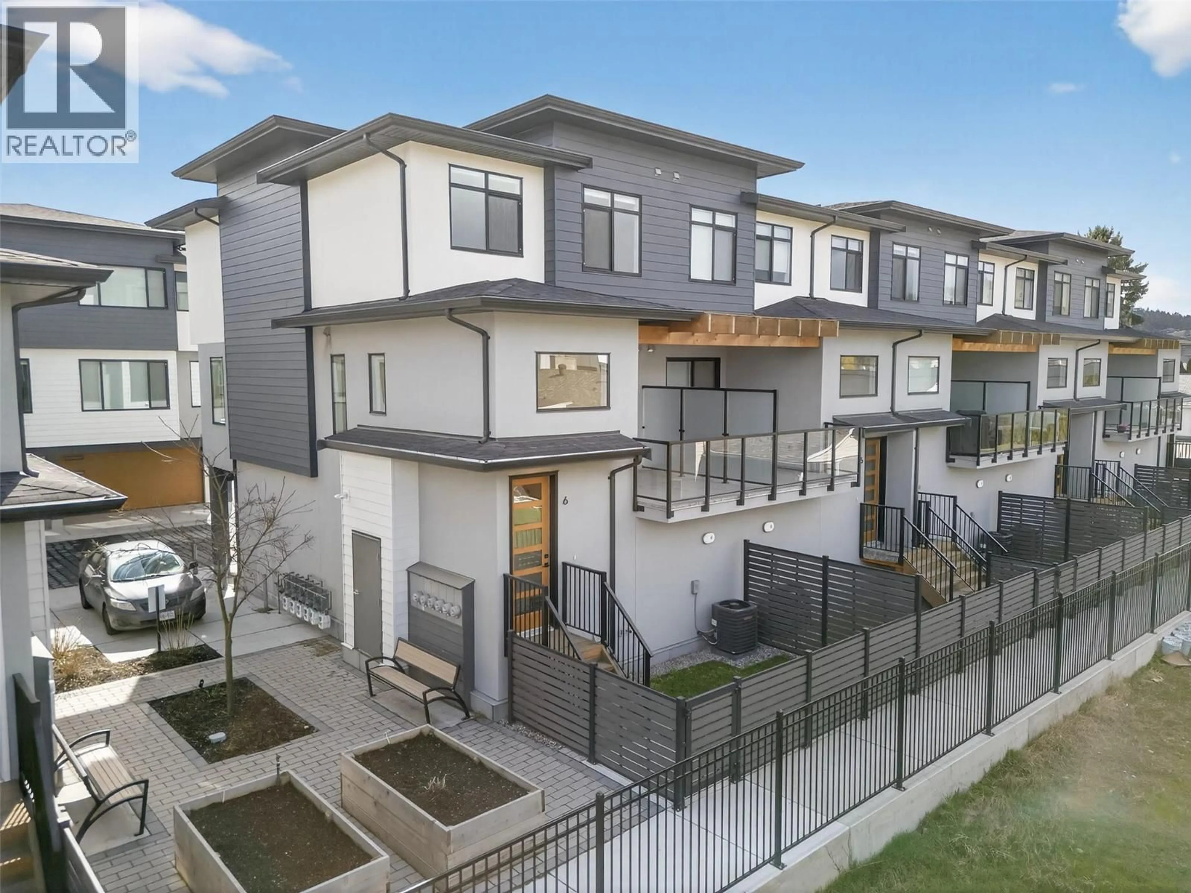 A pic from outside/outdoor area/front of a property/back of a property/a pic from drone, street for 6 - 1225 FINDLAY ROAD, Kelowna British Columbia V1X5B1