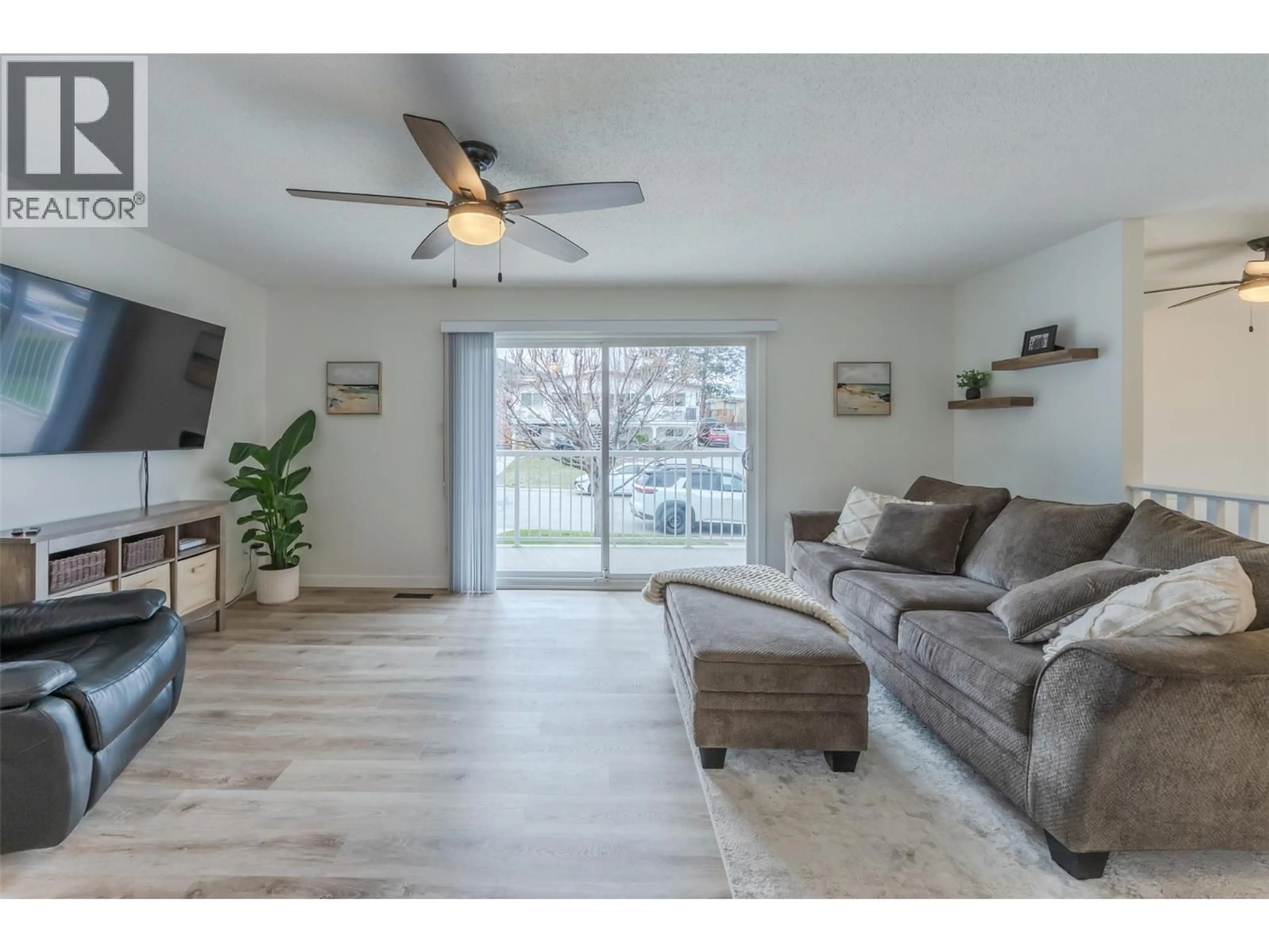Living room with furniture, wood/laminate floor for 1584 BEATTY STREET, Penticton British Columbia V2A7B3