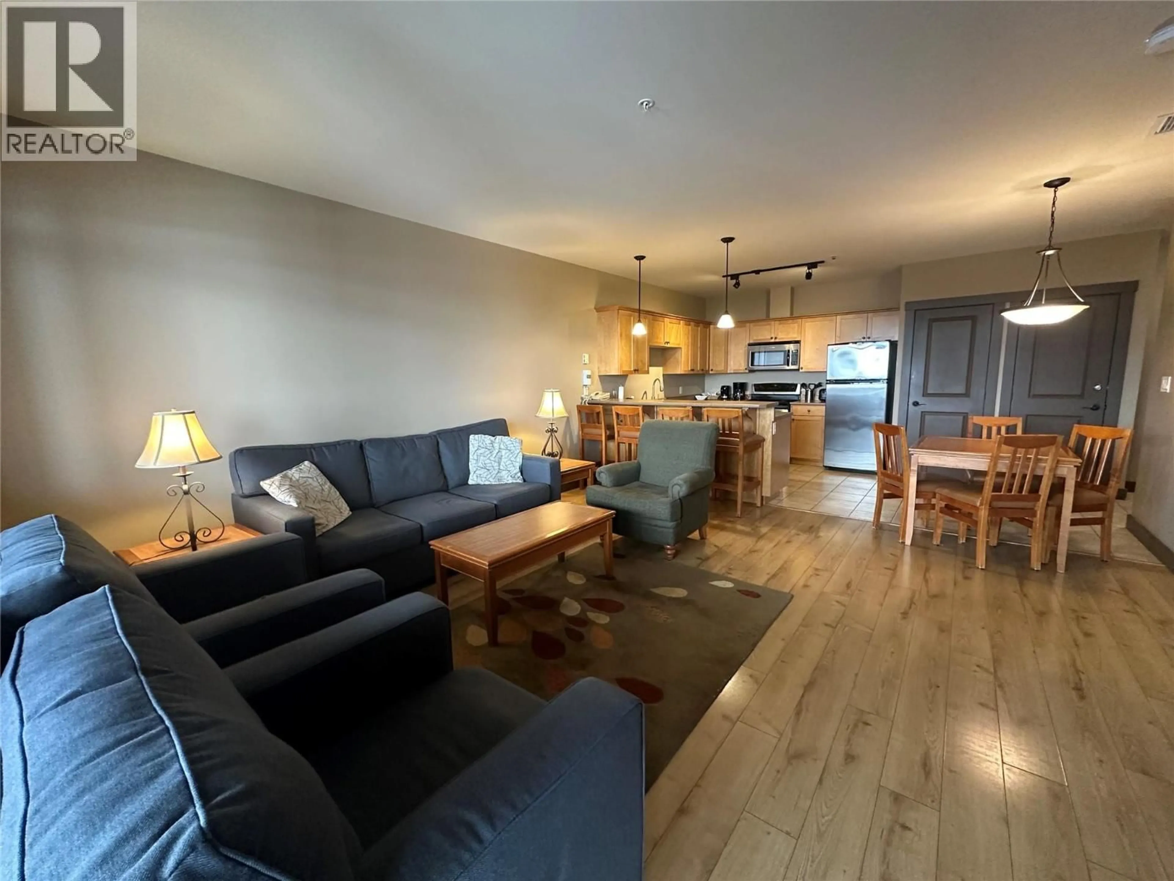 Living room with furniture, wood/laminate floor for 301 - 1420 PALLISER TRAIL, Golden British Columbia V0A1H2