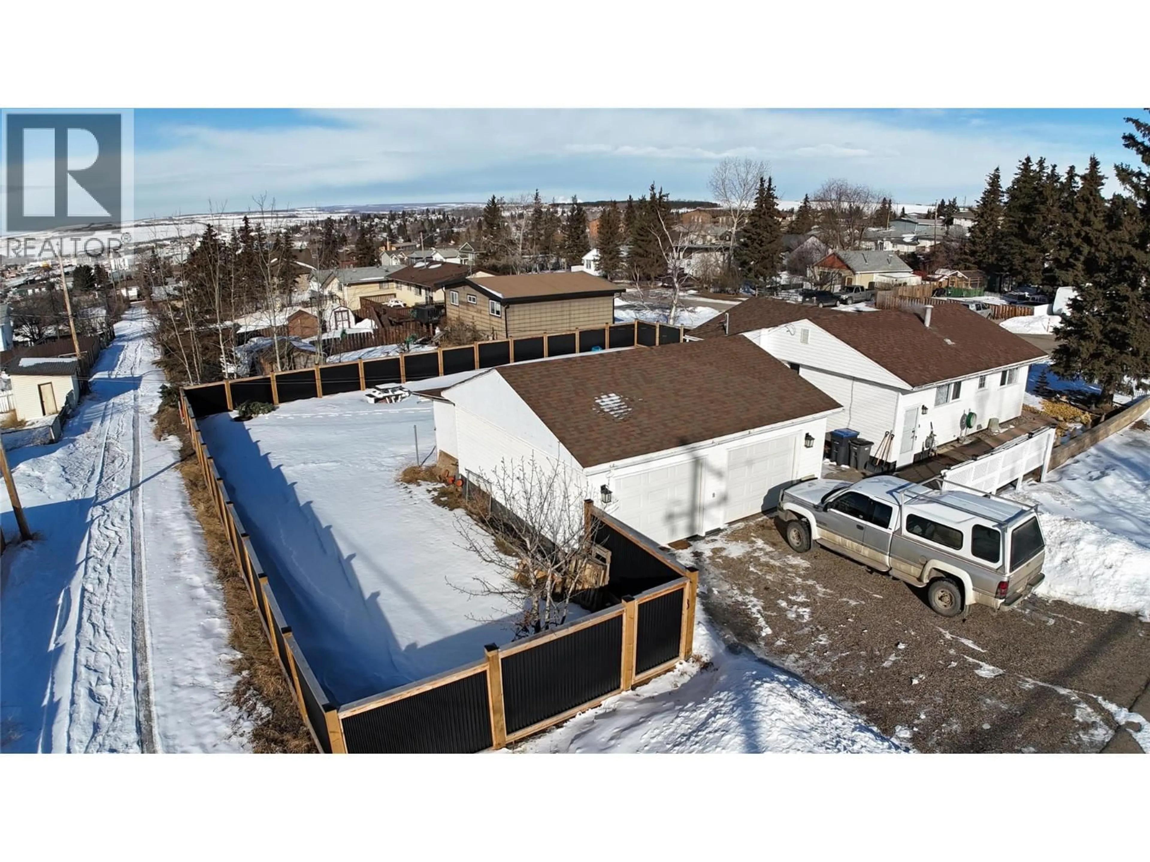 A pic from outside/outdoor area/front of a property/back of a property/a pic from drone, unknown for 601 97A AVENUE, Dawson Creek British Columbia V1G1R2