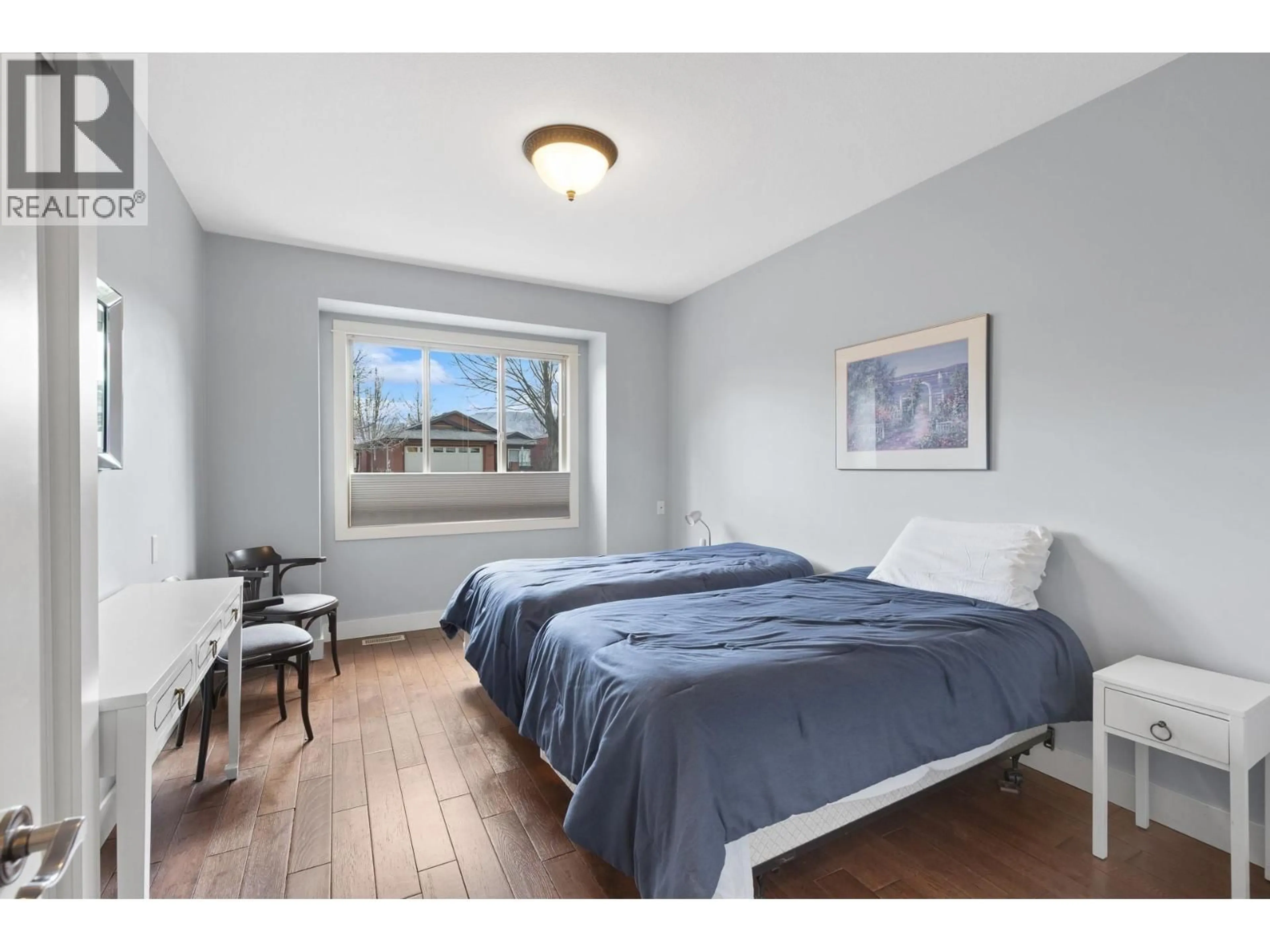 Bedroom with bed, wood/laminate floor for 2288 PINE VISTA PLACE, West Kelowna British Columbia V4T2Y1