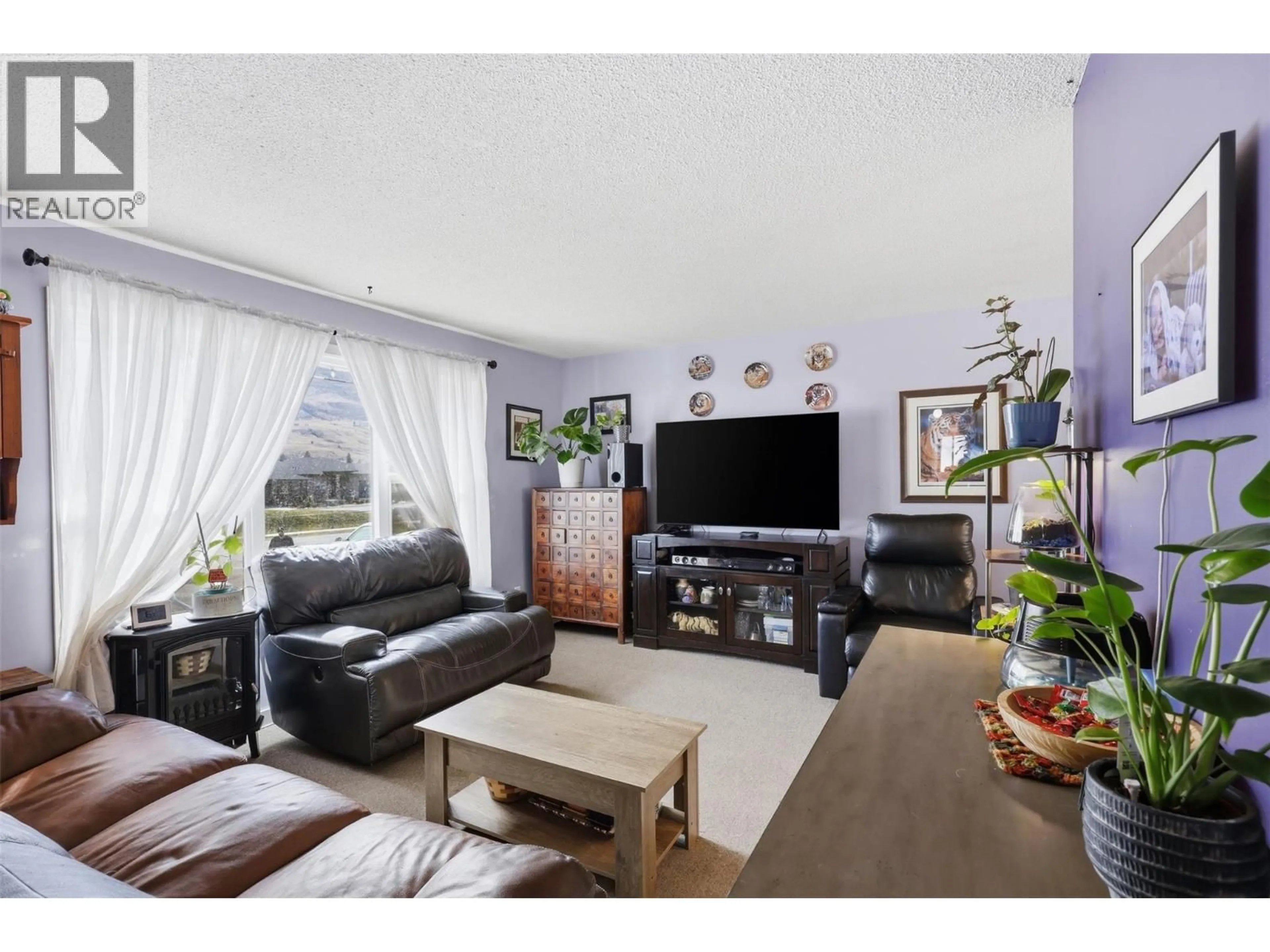 Living room with furniture, wood/laminate floor for 3736 WESTSYDE ROAD, Kamloops British Columbia V2B7H6