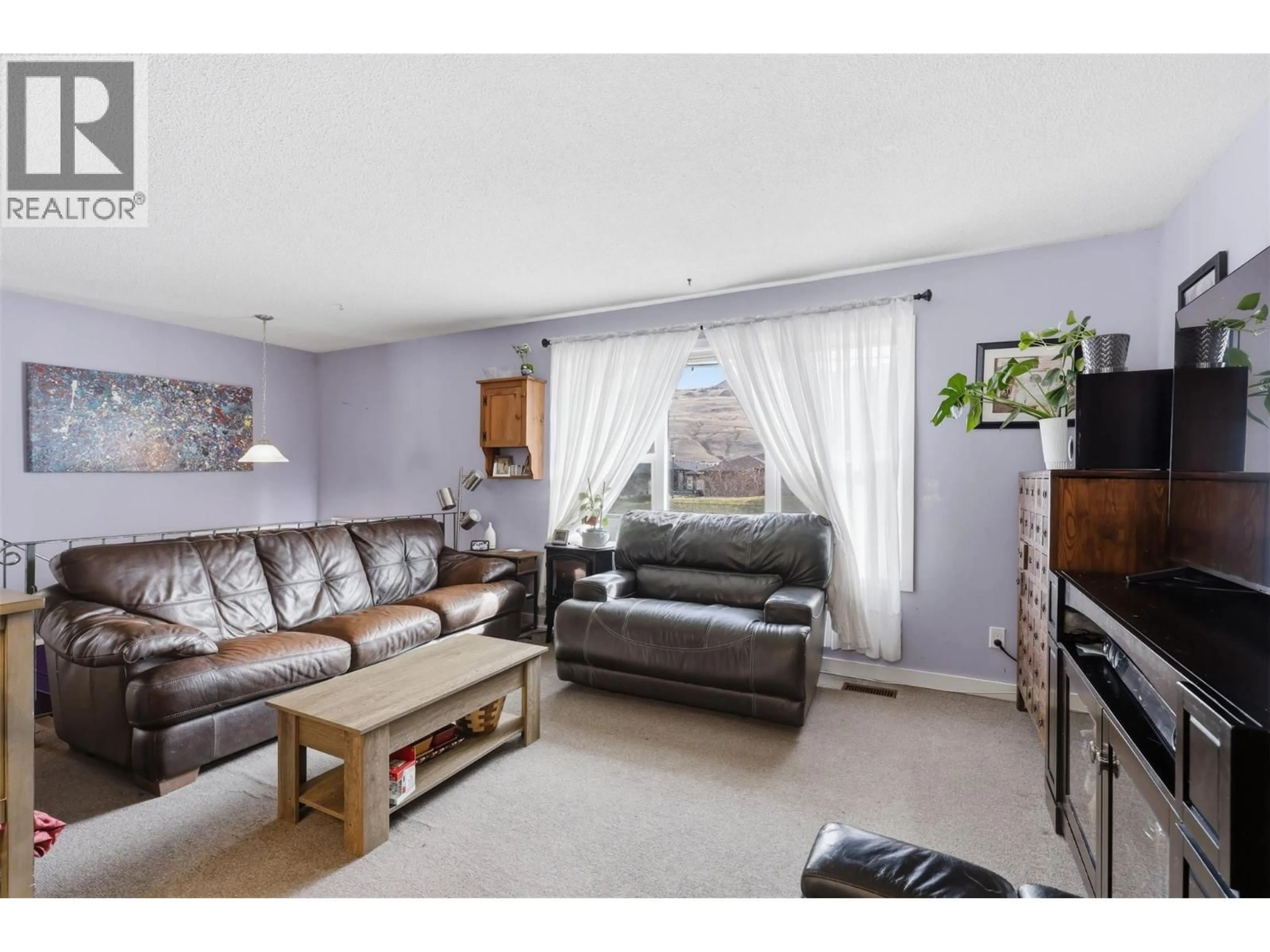 Living room with furniture, wood/laminate floor for 3736 WESTSYDE ROAD, Kamloops British Columbia V2B7H6