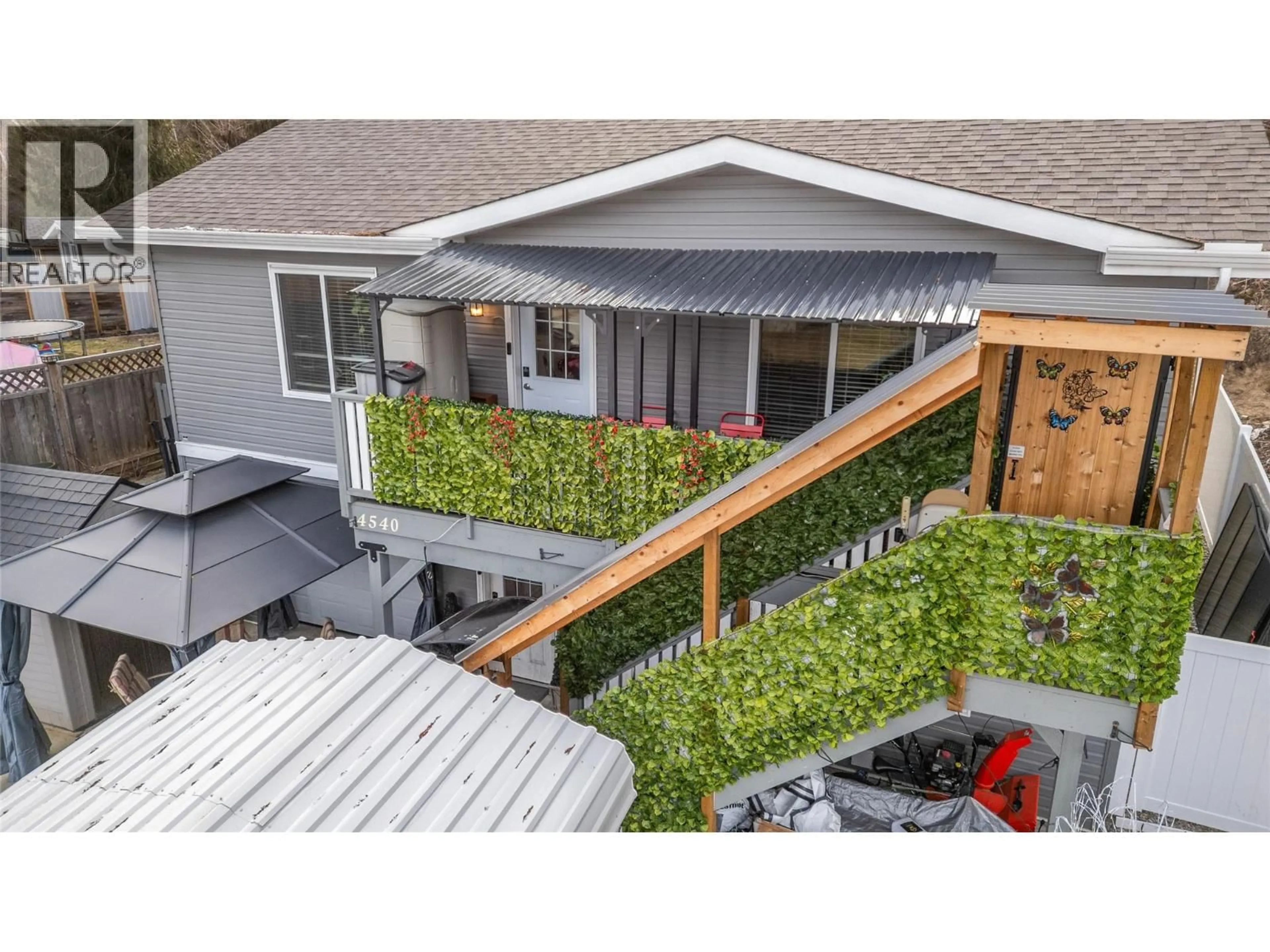 A pic from outside/outdoor area/front of a property/back of a property/a pic from drone, street for 4540 72 AVENUE NORTHEAST, Canoe British Columbia V0E1K0