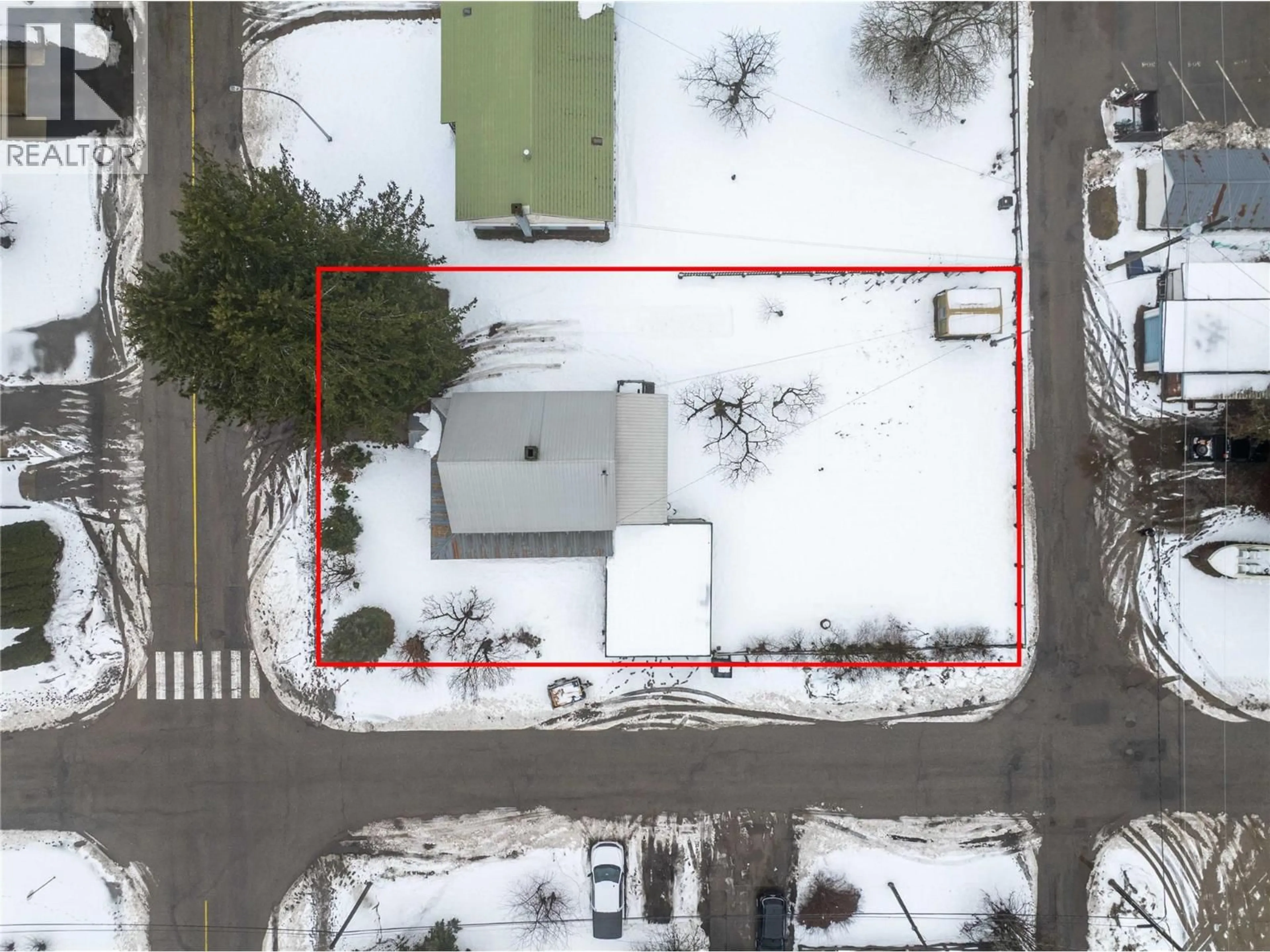 A pic from outside/outdoor area/front of a property/back of a property/a pic from drone, street for 1202 FIRST STREET, Revelstoke British Columbia V0E2S0