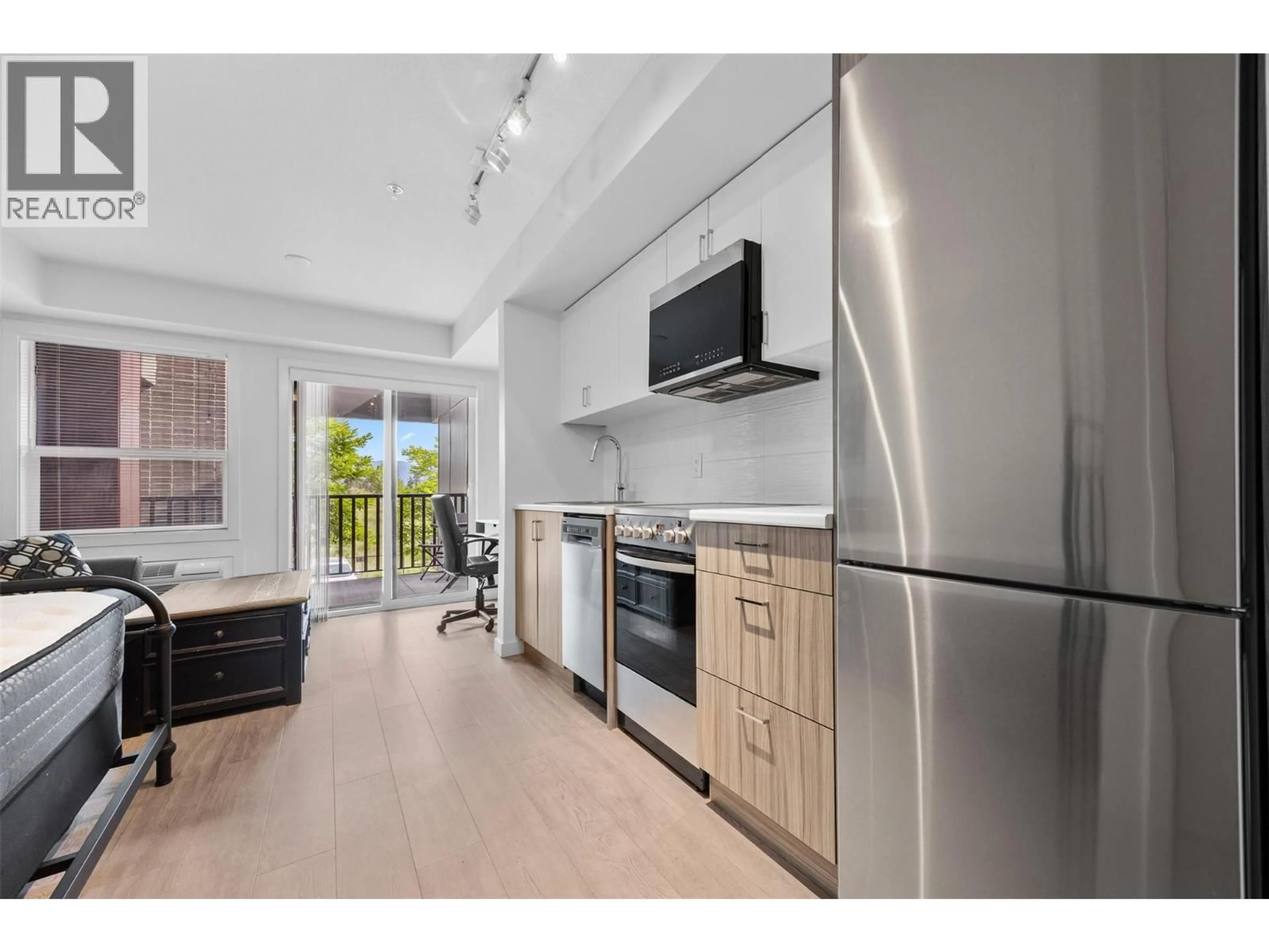 Open concept kitchen, unknown for 103 - 625 ACADEMY WAY, Kelowna British Columbia V1V0E3