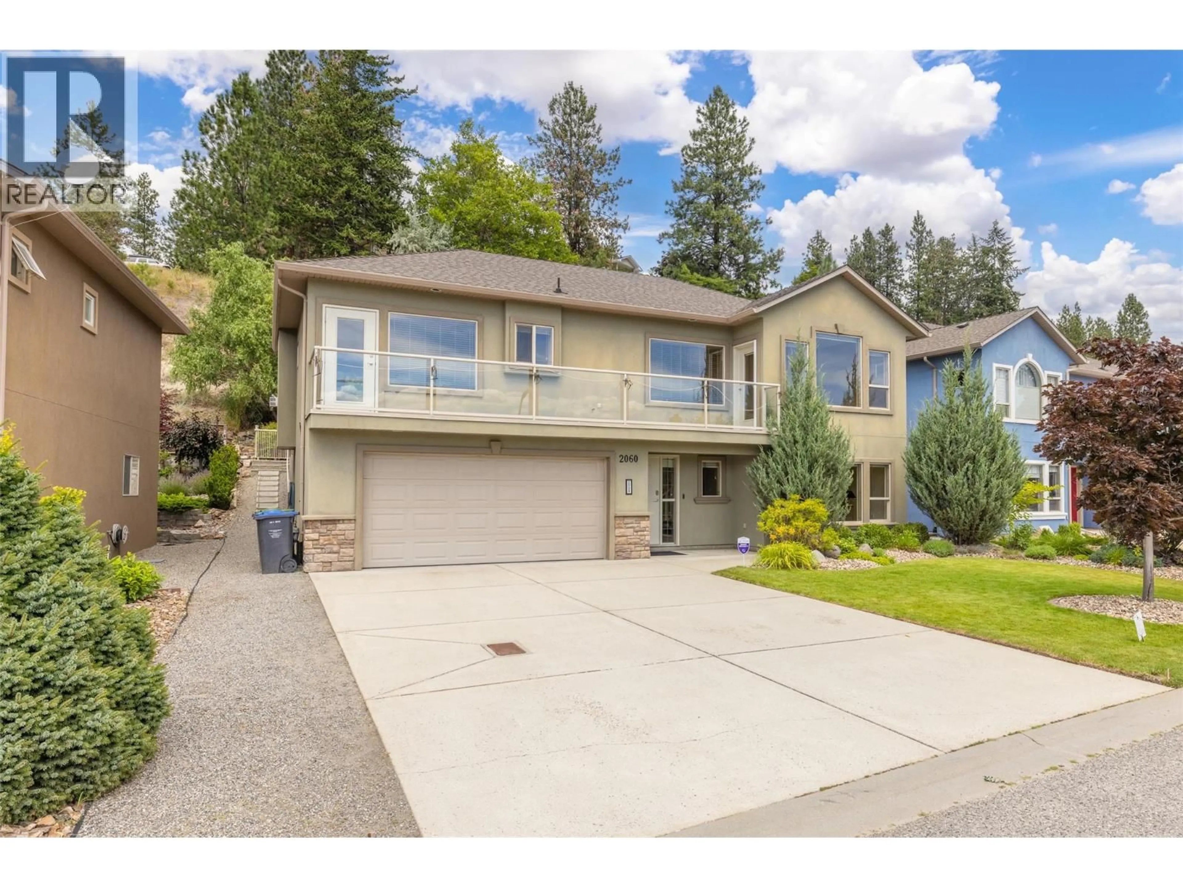 Home with vinyl exterior material, street for 2060 SPYGLASS WAY, West Kelowna British Columbia V1Z3Z7
