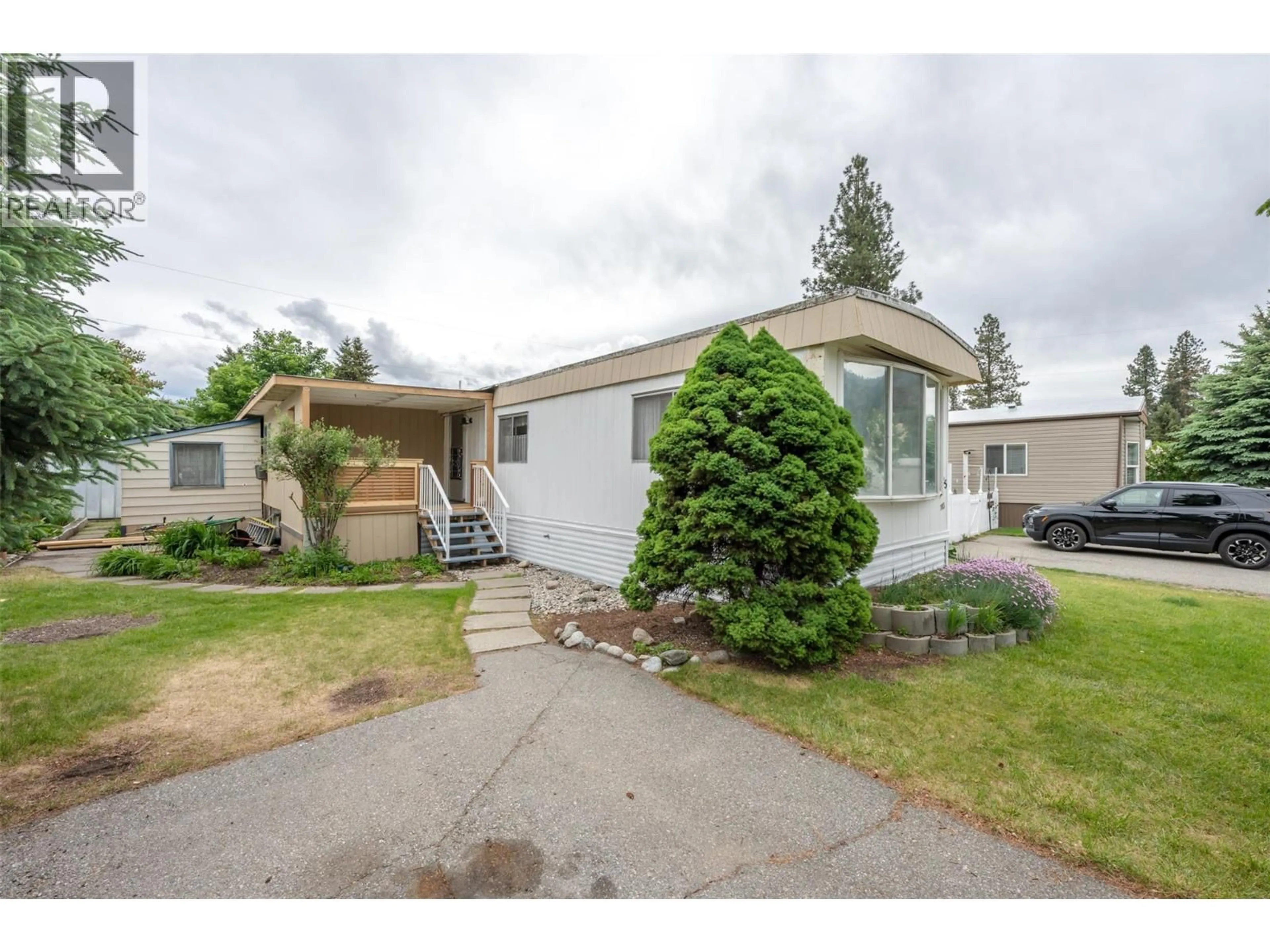 Home with vinyl exterior material, street for C25 - 4505 MCLEAN CREEK ROAD, Okanagan Falls British Columbia V0H1R1