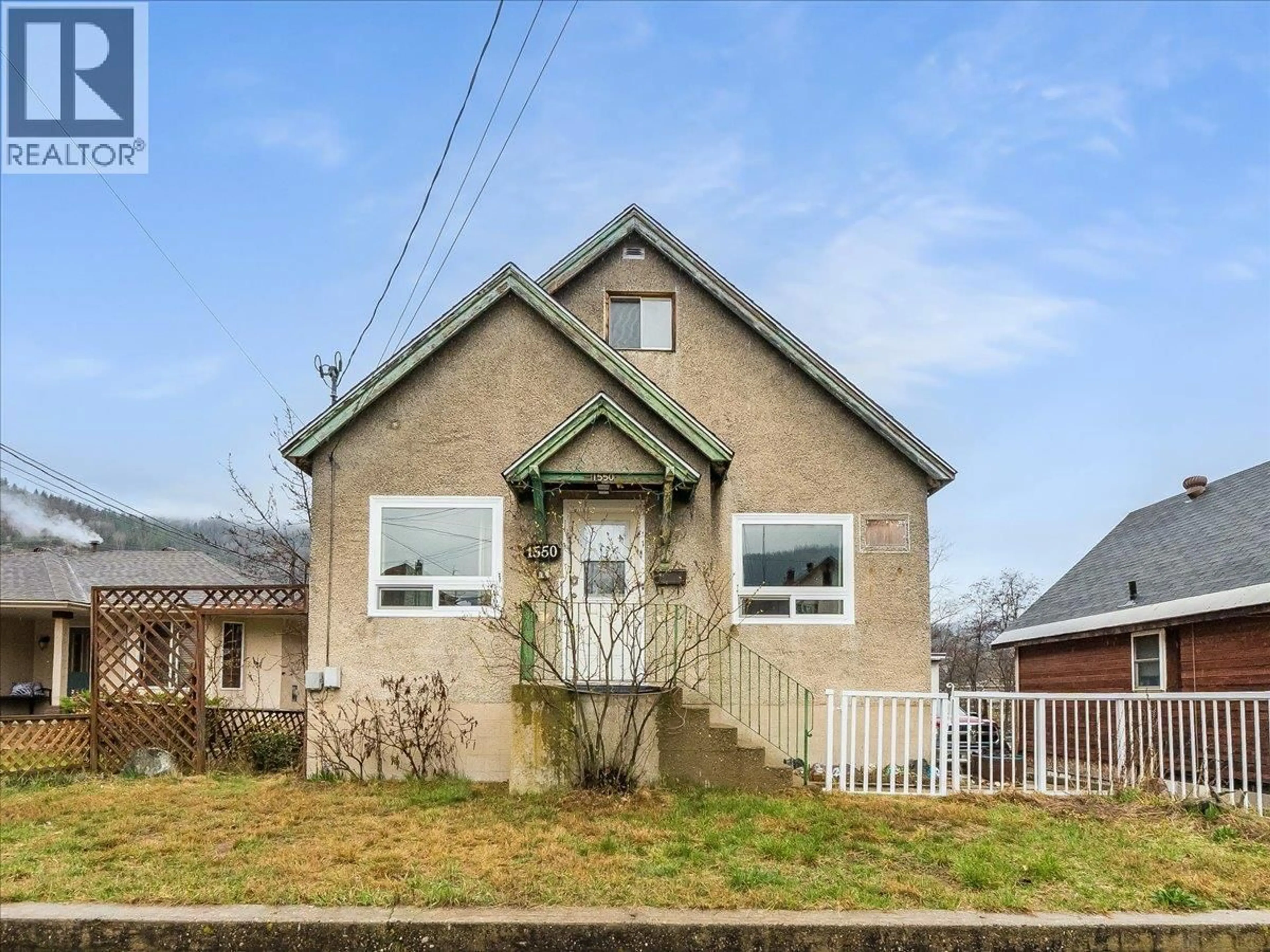 Home with brick exterior material, street for 1550 COLUMBIA AVENUE, Trail British Columbia V1R1J9