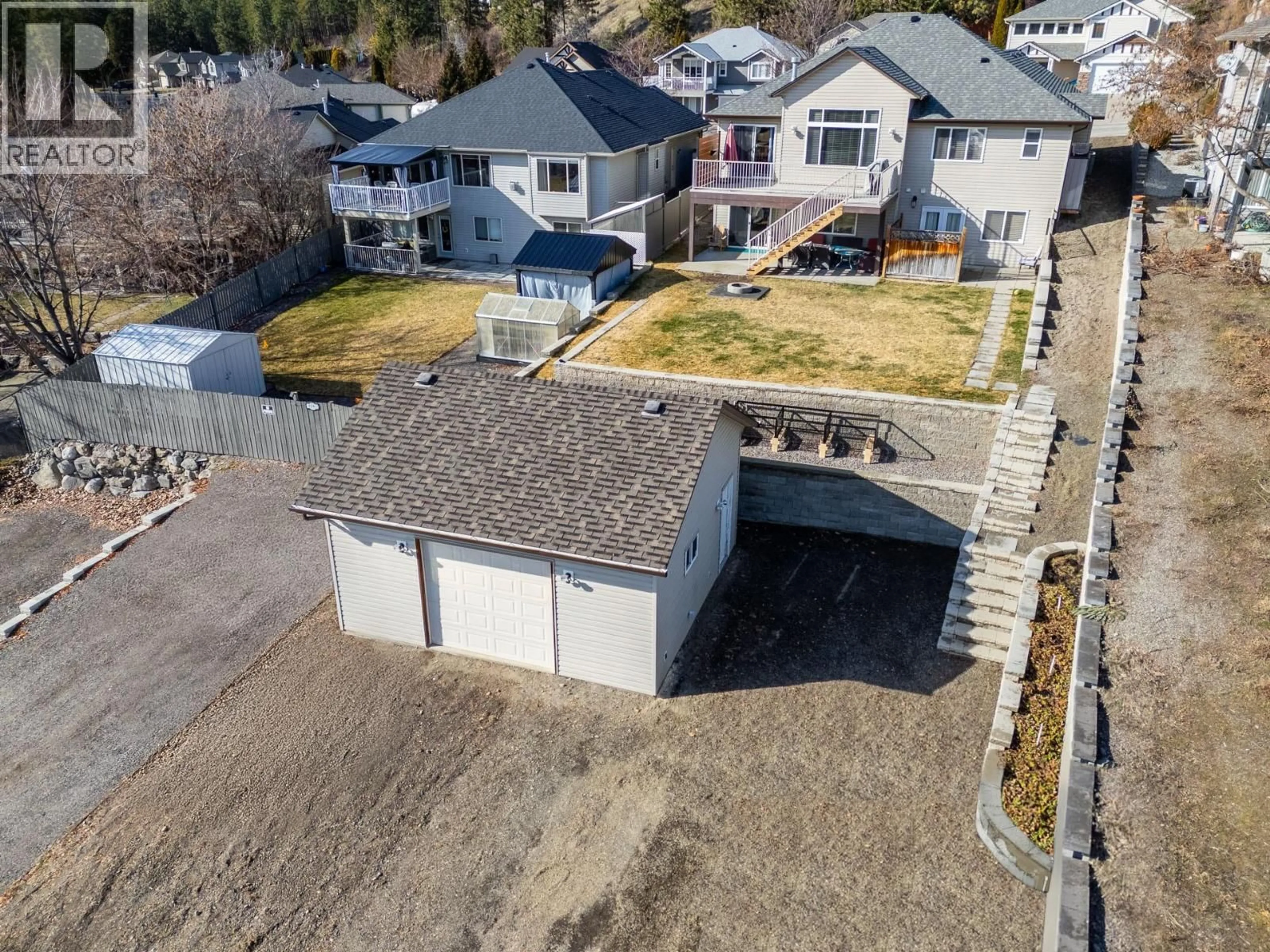 A pic from outside/outdoor area/front of a property/back of a property/a pic from drone, street for 2089 ROSE TREE ROAD, West Kelowna British Columbia V1Z4A7