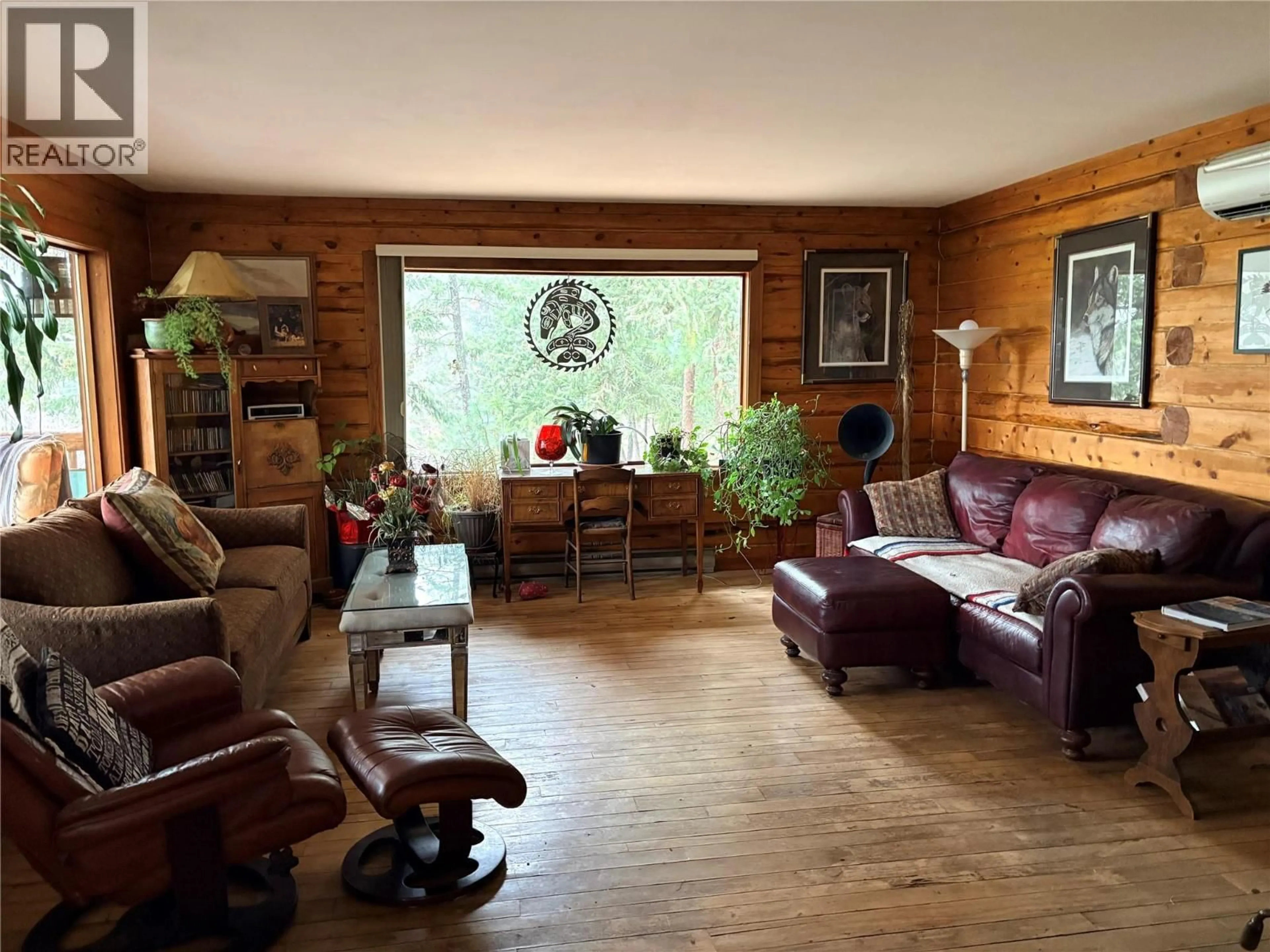 Living room with furniture, wood/laminate floor for 7072 GLENFIR ROAD, Naramata British Columbia V0H1N1