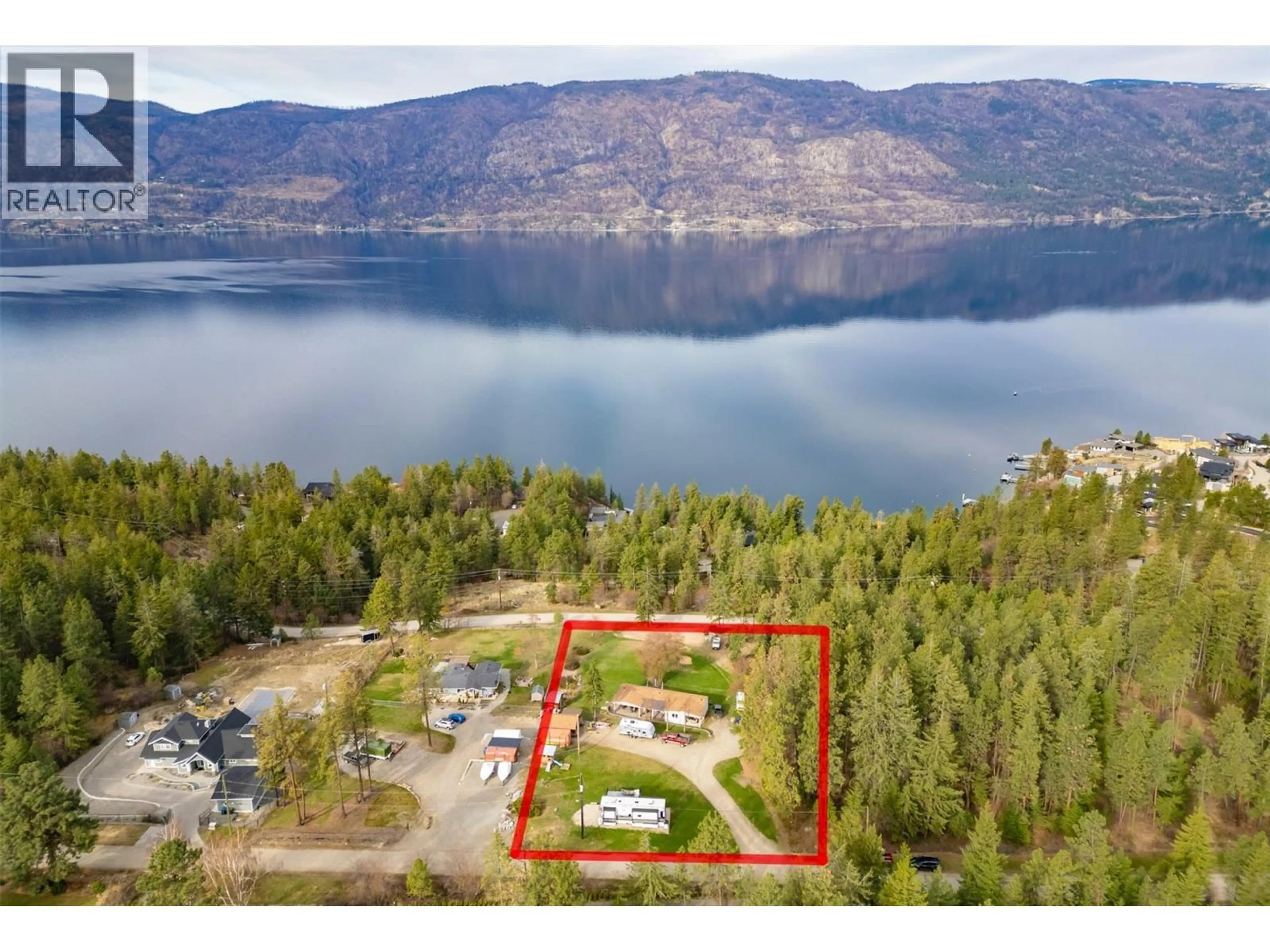 A pic from outside/outdoor area/front of a property/back of a property/a pic from drone, water/lake/river/ocean view for 5574 STUBBS ROAD, Lake Country British Columbia V4V1N1