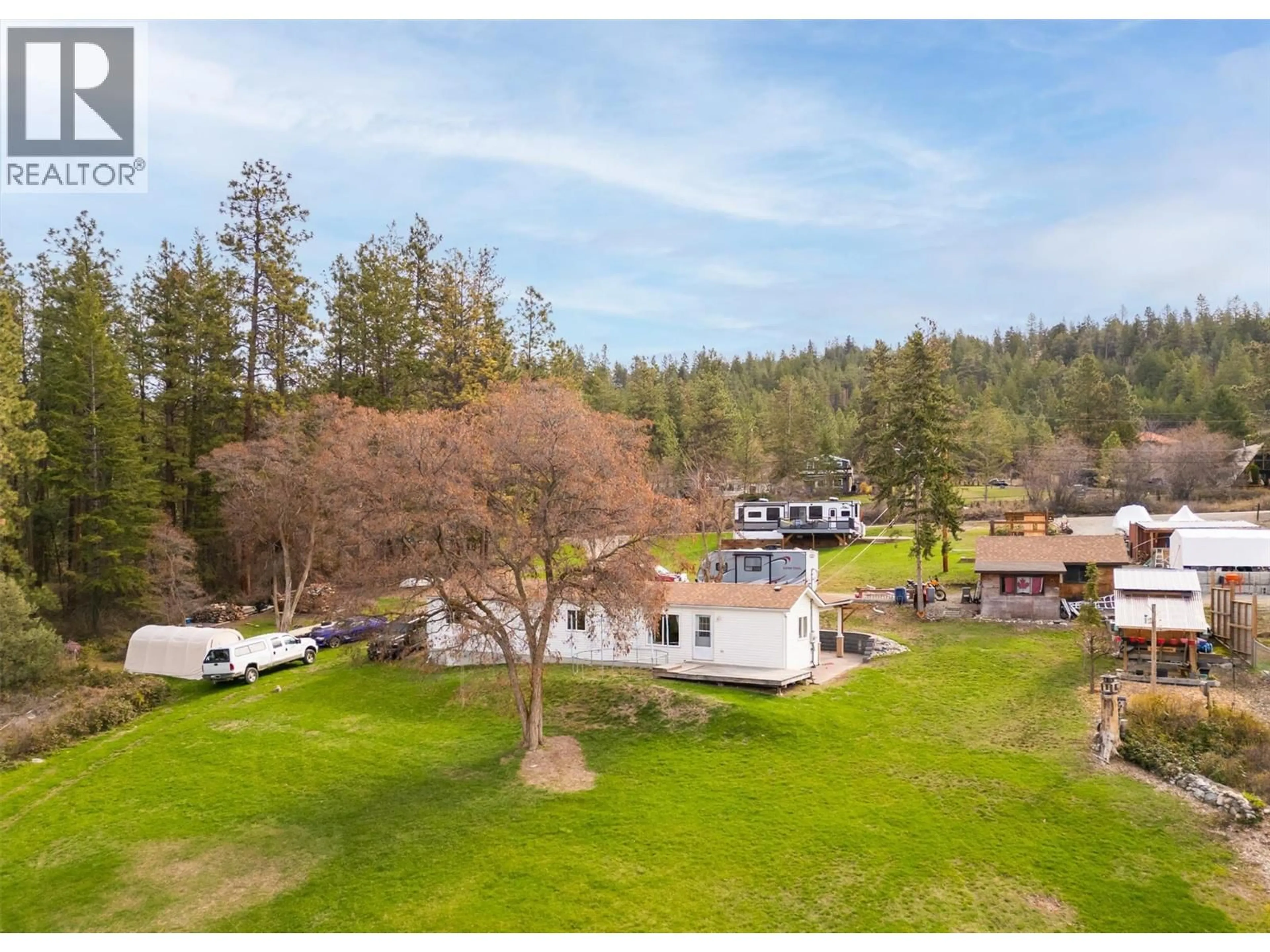 A pic from outside/outdoor area/front of a property/back of a property/a pic from drone, mountain view for 5574 STUBBS ROAD, Lake Country British Columbia V4V1N1