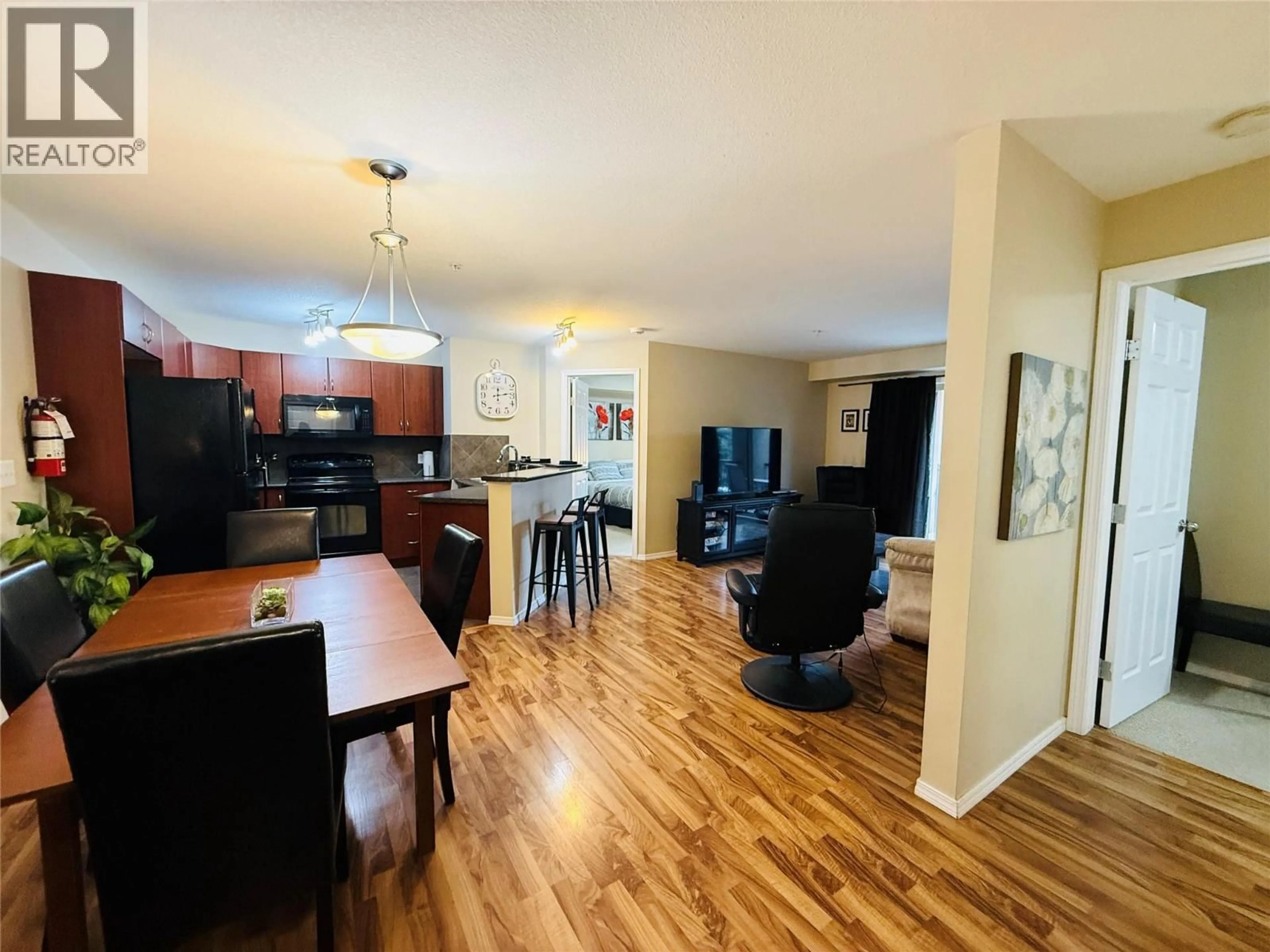 Open concept kitchen, wood/laminate floor for 2212 - 205 THIRD AVENUE, Invermere British Columbia V0A1K7