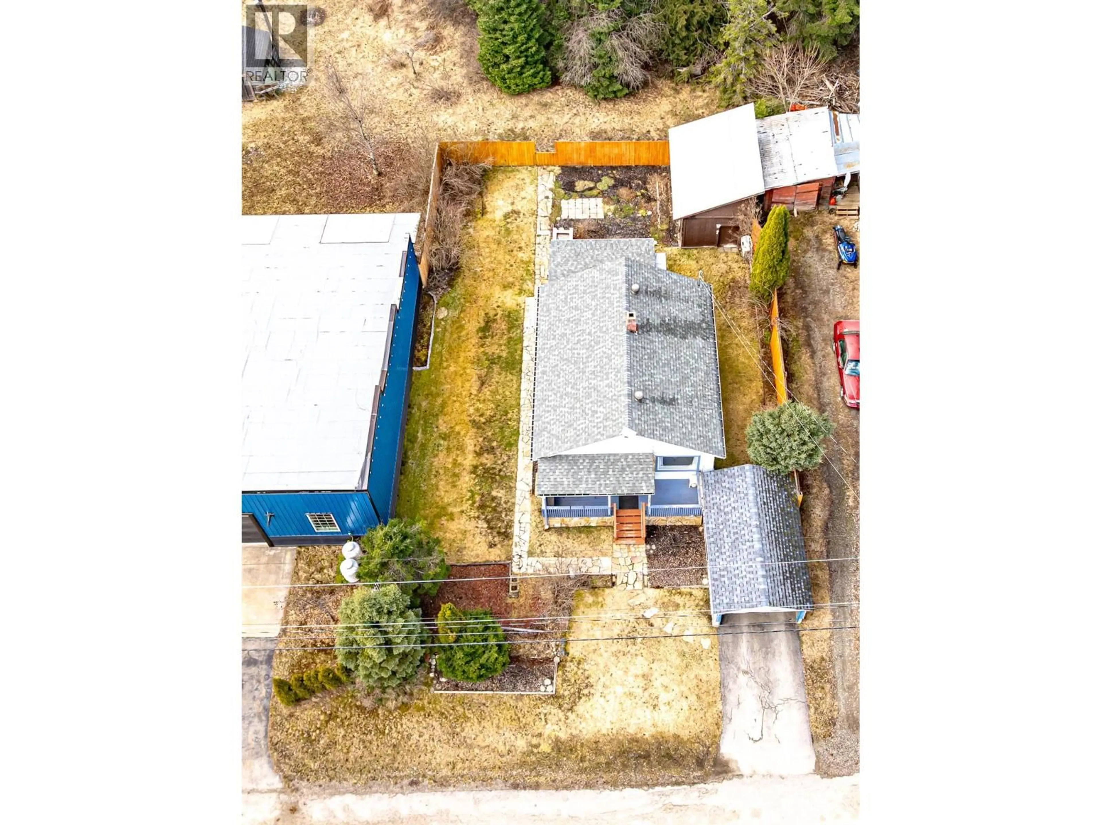 A pic from outside/outdoor area/front of a property/back of a property/a pic from drone, street for 6910 1ST AVENUE, Ymir British Columbia V0G2K0