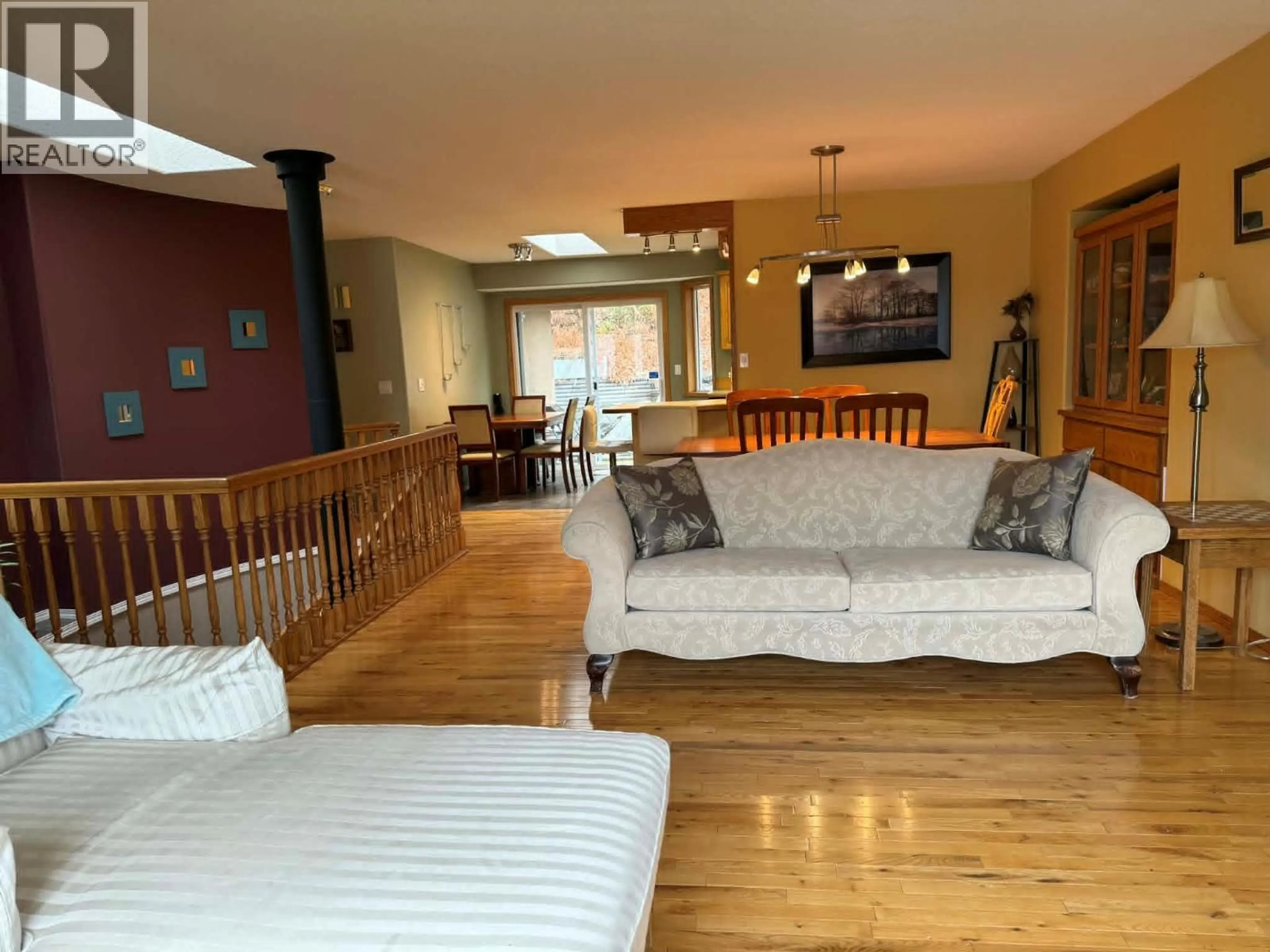 Living room with furniture, wood/laminate floor for 3320 14TH AVENUE, Castlegar British Columbia V1N4G1