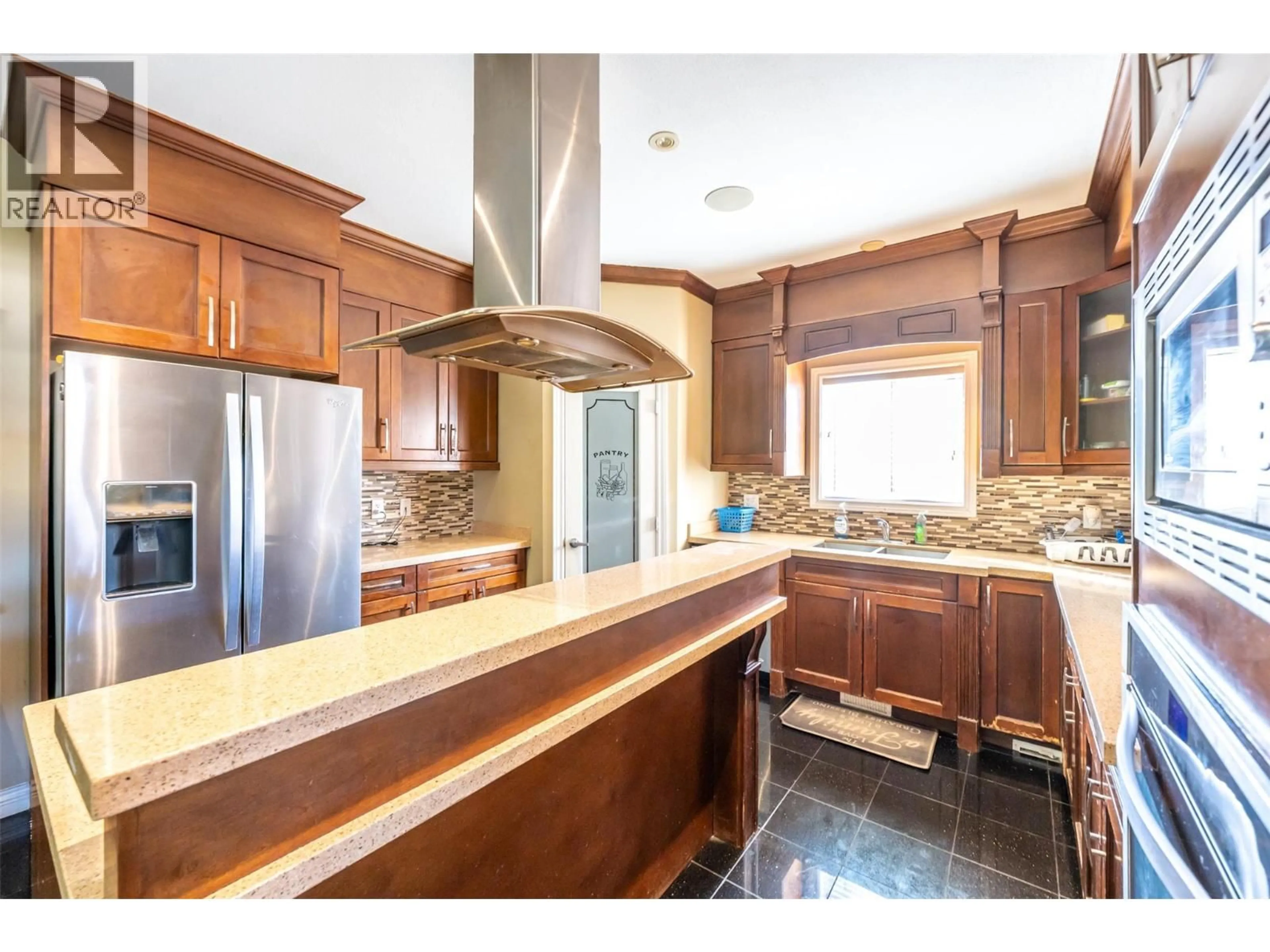 Open concept kitchen, ceramic/tile floor for 102 - 297 WATERFORD AVENUE, Penticton British Columbia V2A6J4