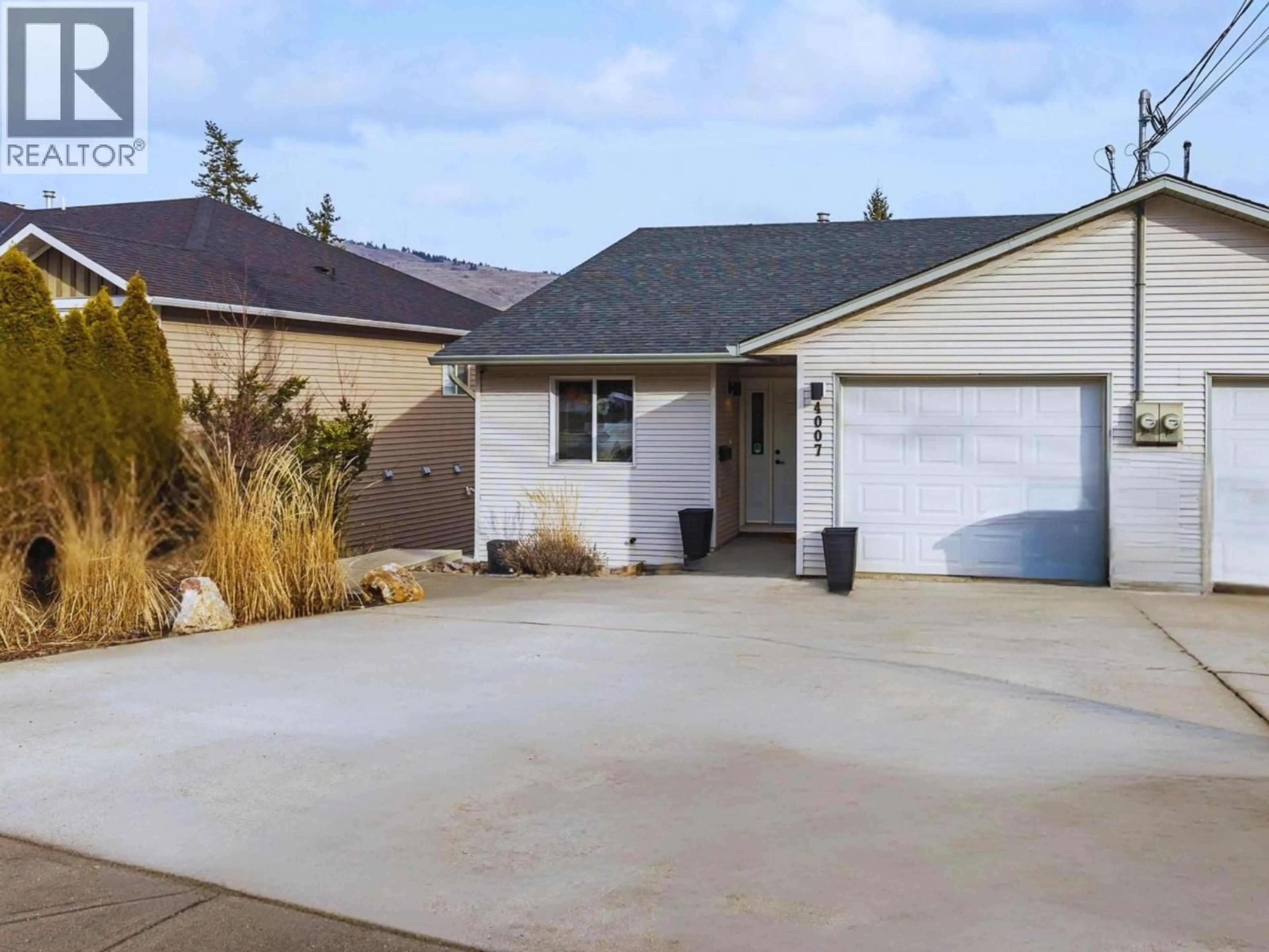 Home with vinyl exterior material, street for 4007 OKANAGAN AVENUE, Vernon British Columbia V1T1K8