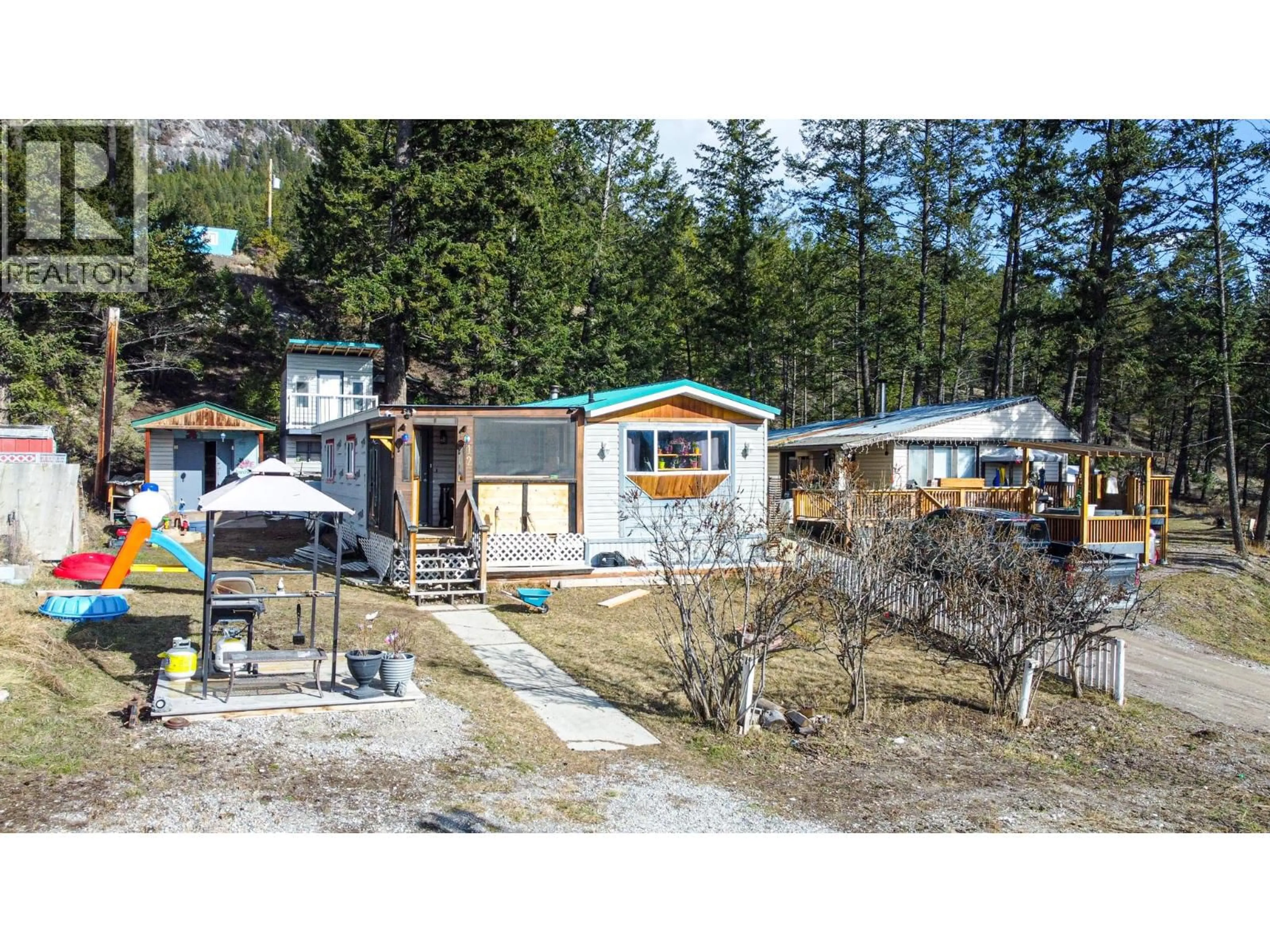 A pic from outside/outdoor area/front of a property/back of a property/a pic from drone, street for 12 EACRETT ROAD, Radium Hot Springs British Columbia V0A1M0