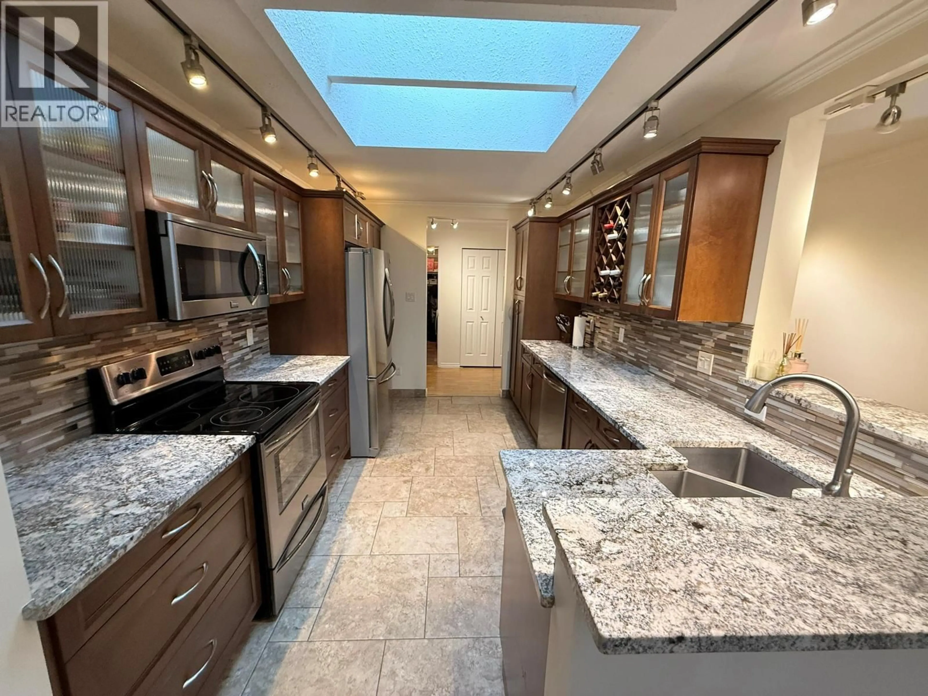 Contemporary kitchen, ceramic/tile floor for 205 - 1580 SPRINGFIELD ROAD, Kelowna British Columbia V1Y5V4