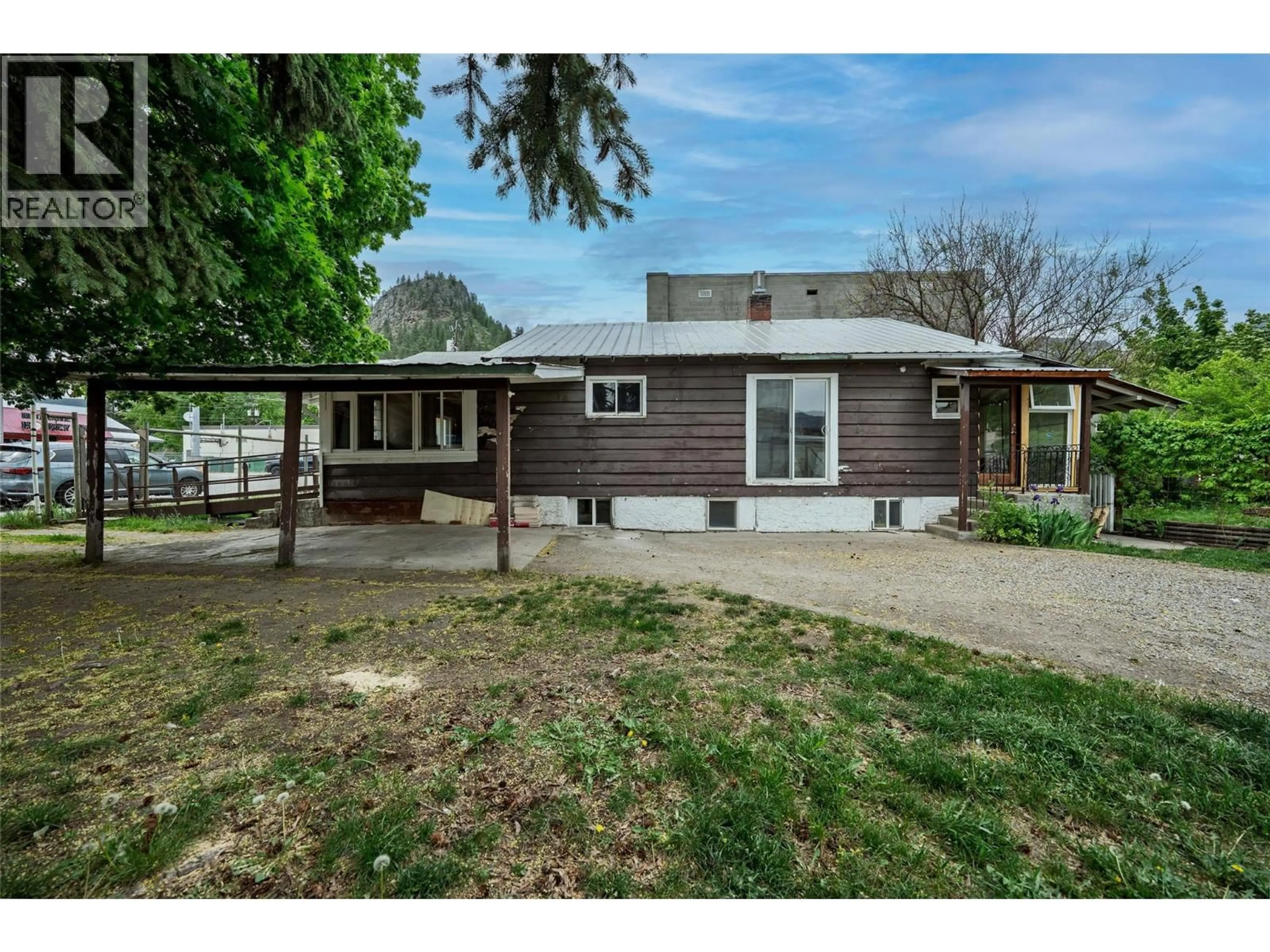 A pic from outside/outdoor area/front of a property/back of a property/a pic from drone, street for 7440 3RD STREET, Grand Forks British Columbia V0H1H0