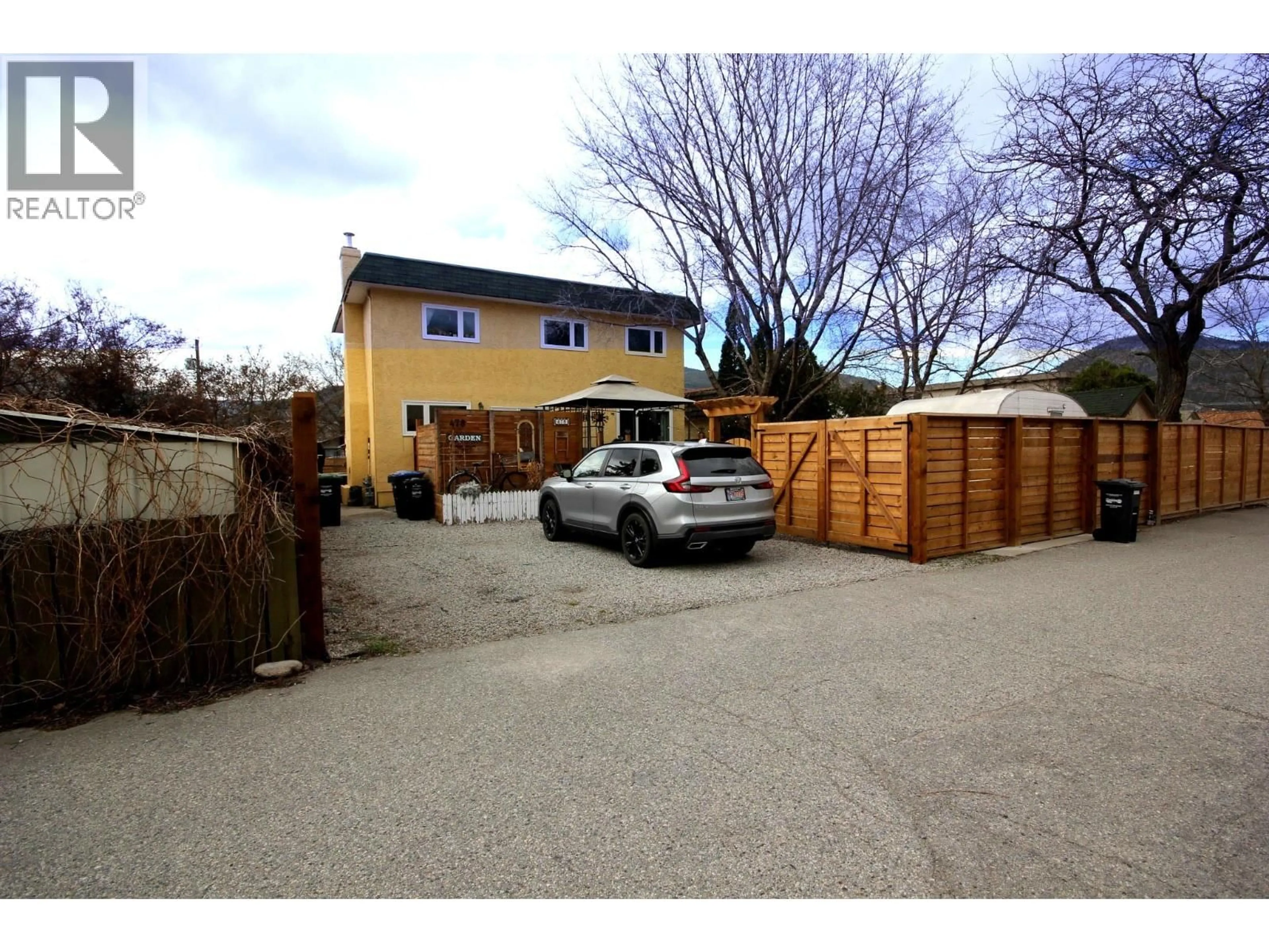 A pic from outside/outdoor area/front of a property/back of a property/a pic from drone, street for 478 CARIBOU STREET, Penticton British Columbia V2A5W6