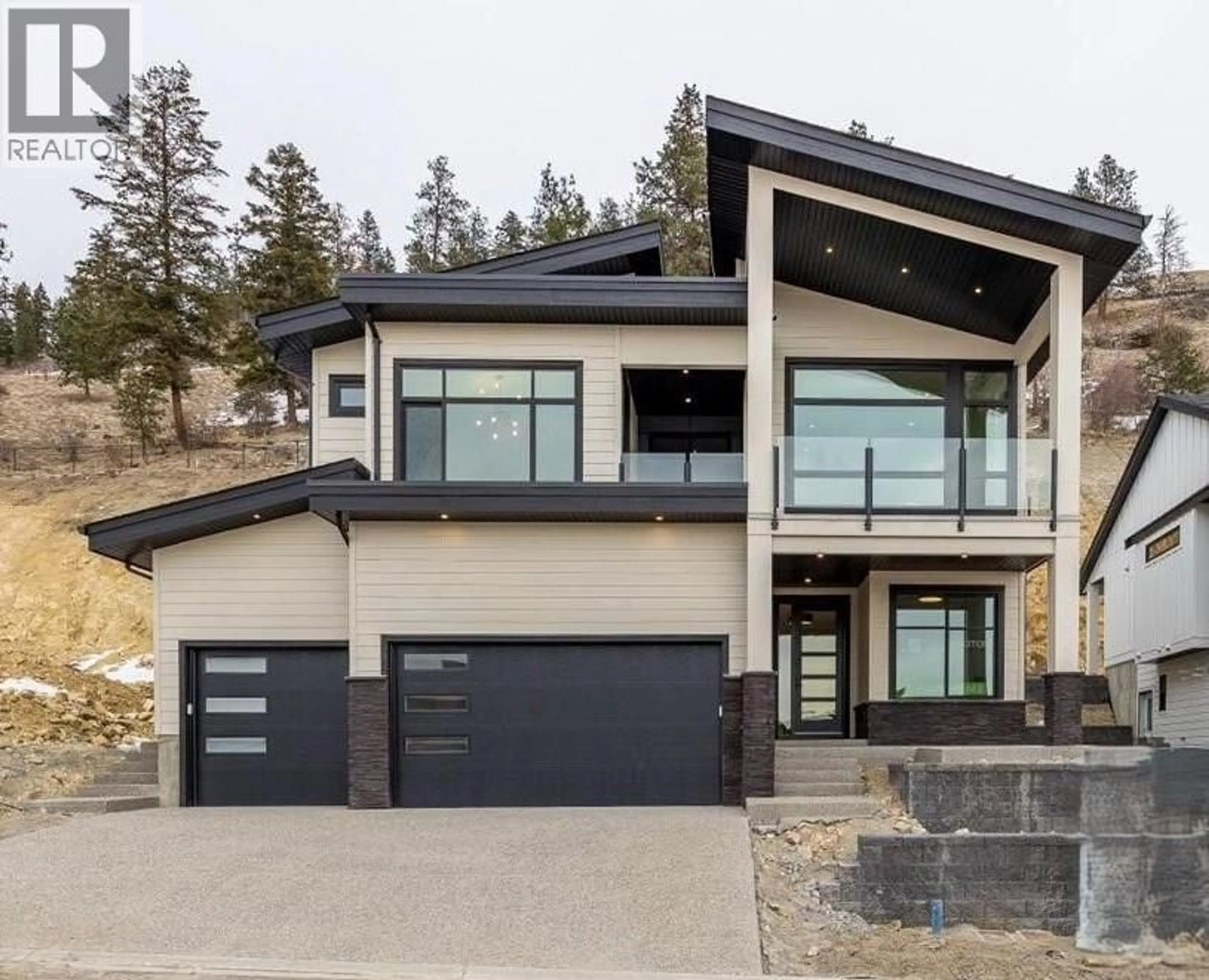 Home with vinyl exterior material, mountain view for 1165 LONE PINE DRIVE, Kelowna British Columbia V1P0A5