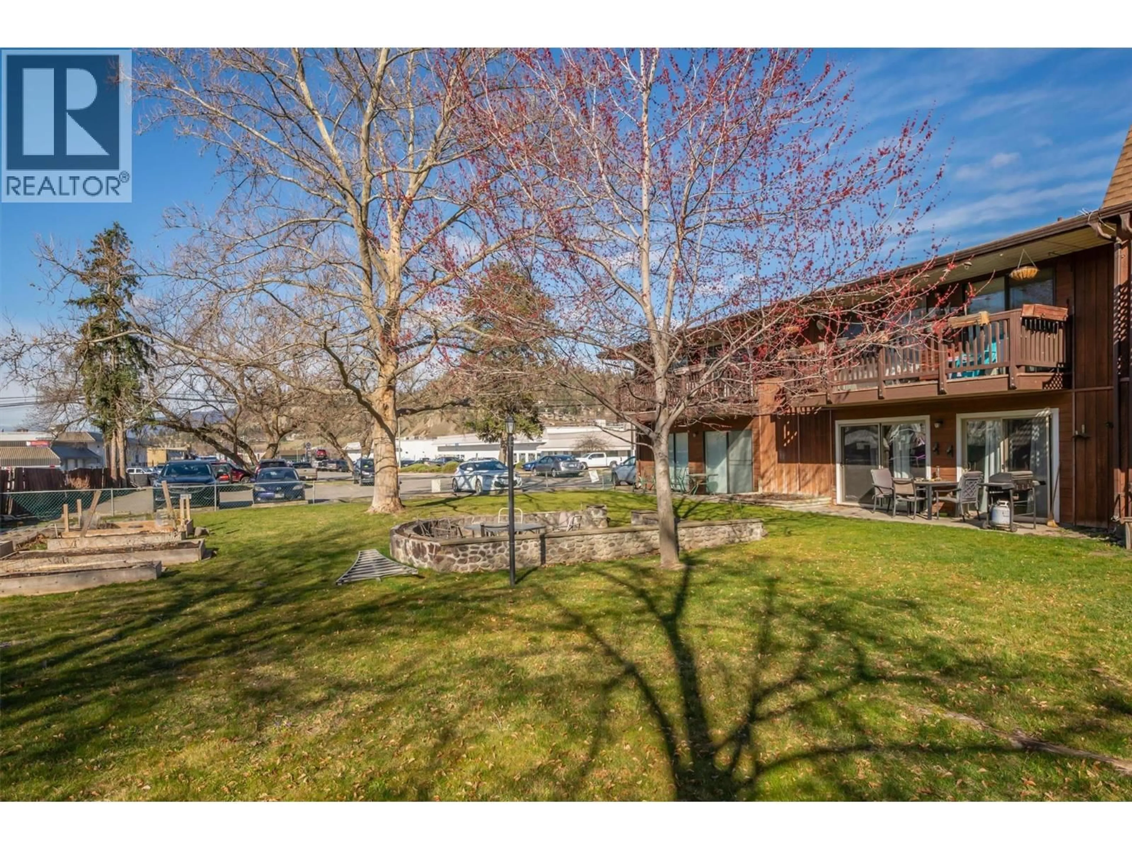A pic from outside/outdoor area/front of a property/back of a property/a pic from drone, water/lake/river/ocean view for 102 - 215 MILLS ROAD, Kelowna British Columbia V1X4G6