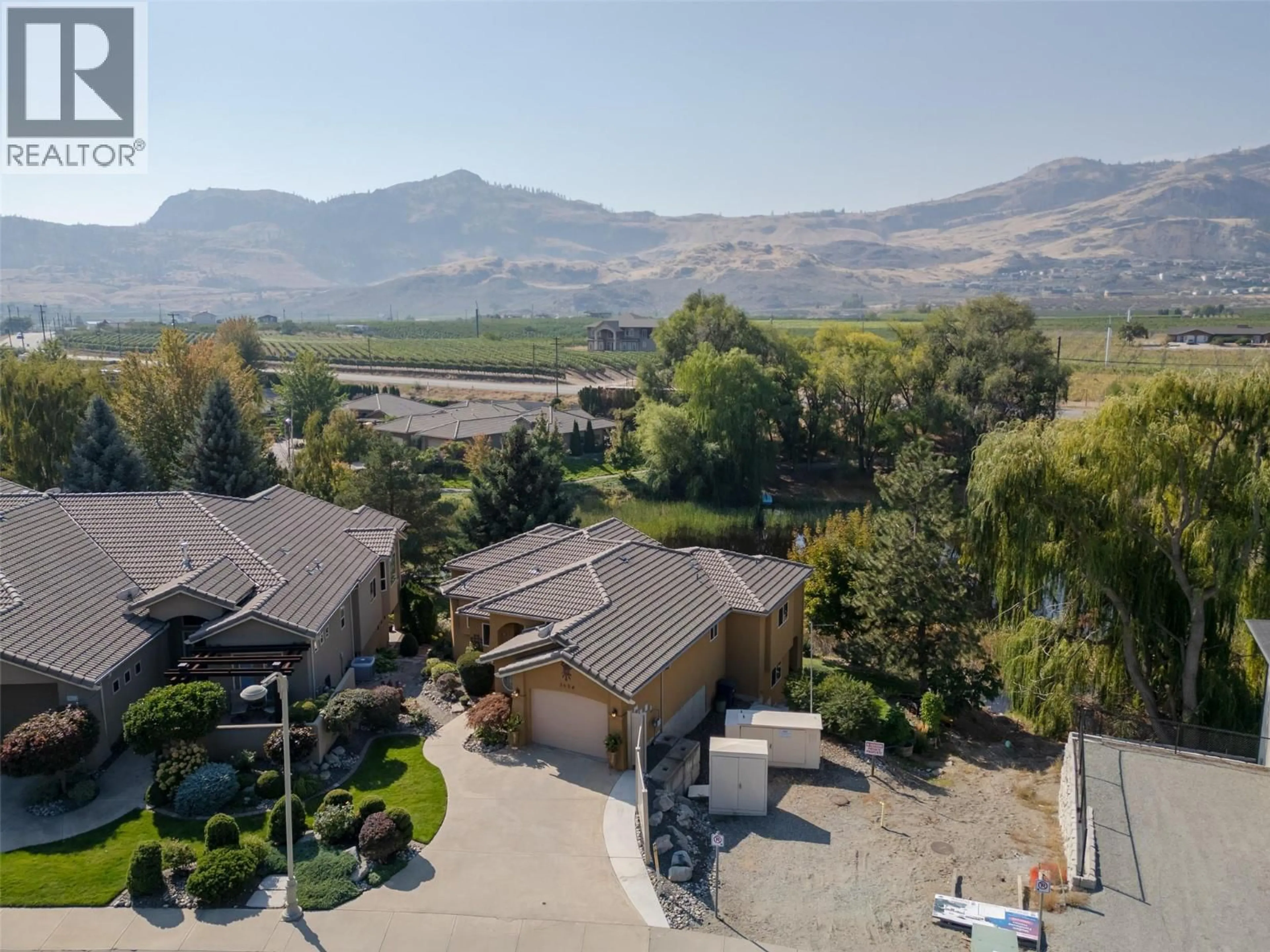 A pic from outside/outdoor area/front of a property/back of a property/a pic from drone, mountain view for 3604 LOBELIA DRIVE, Osoyoos British Columbia V0H1V1