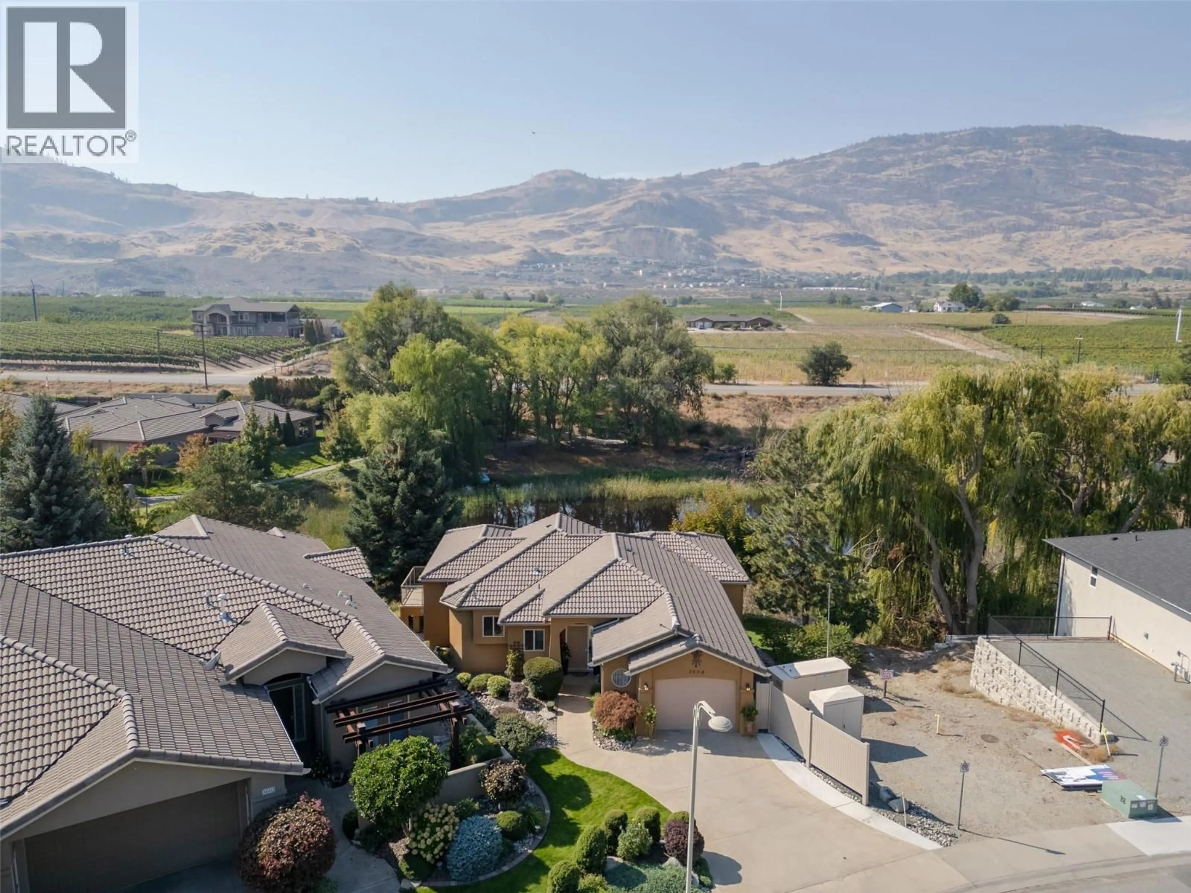 A pic from outside/outdoor area/front of a property/back of a property/a pic from drone, mountain view for 3604 LOBELIA DRIVE, Osoyoos British Columbia V0H1V1