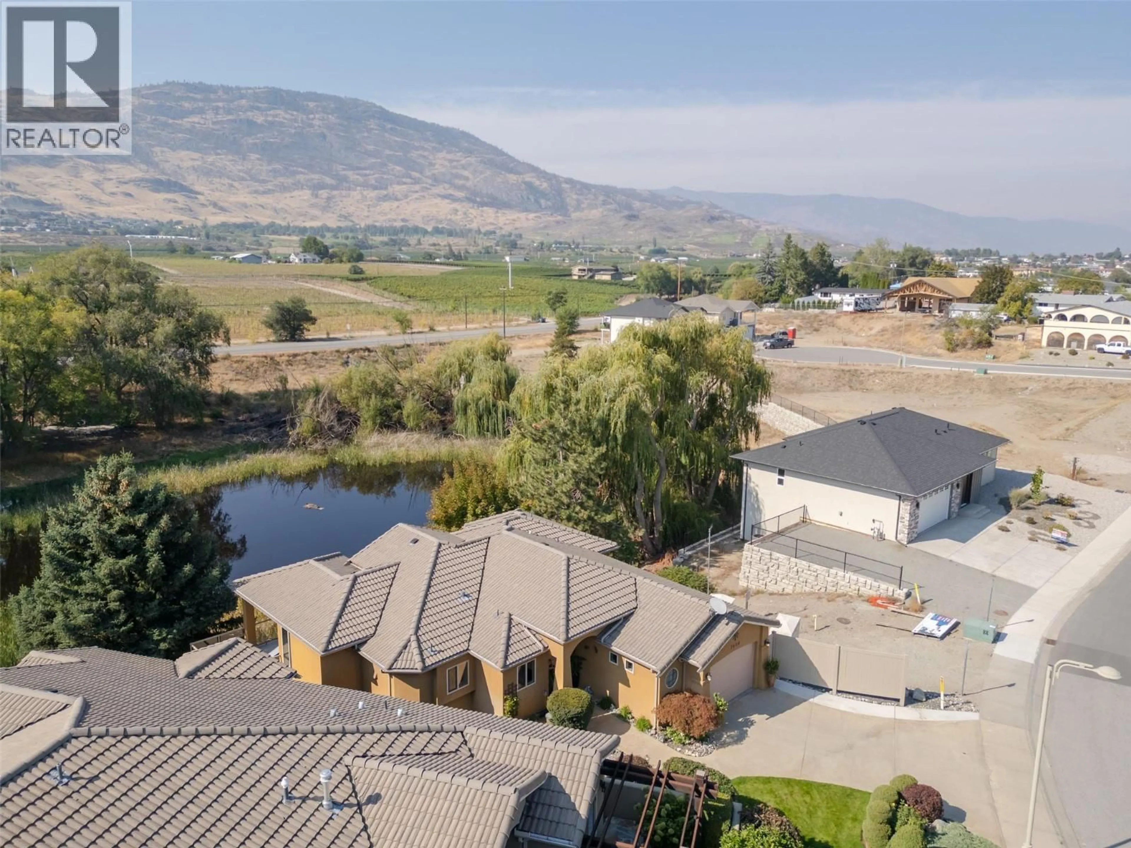 A pic from outside/outdoor area/front of a property/back of a property/a pic from drone, mountain view for 3604 LOBELIA DRIVE, Osoyoos British Columbia V0H1V1