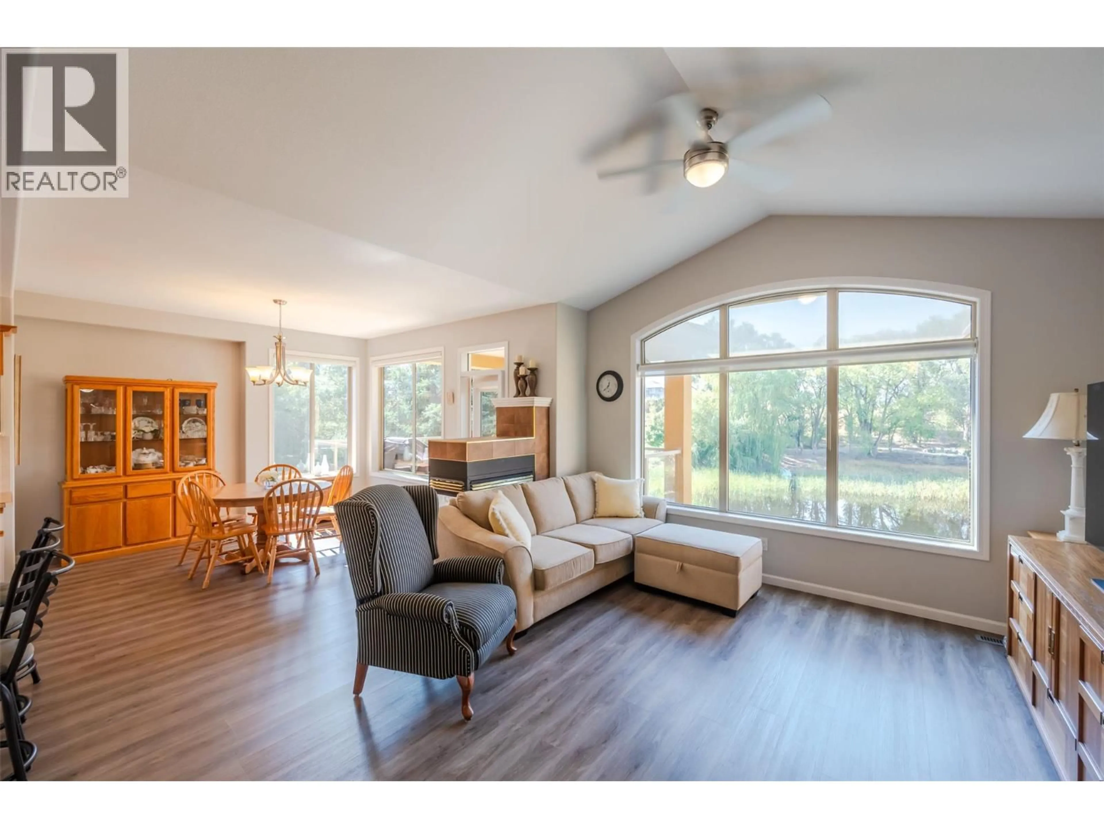 Living room with furniture, wood/laminate floor for 3604 LOBELIA DRIVE, Osoyoos British Columbia V0H1V1
