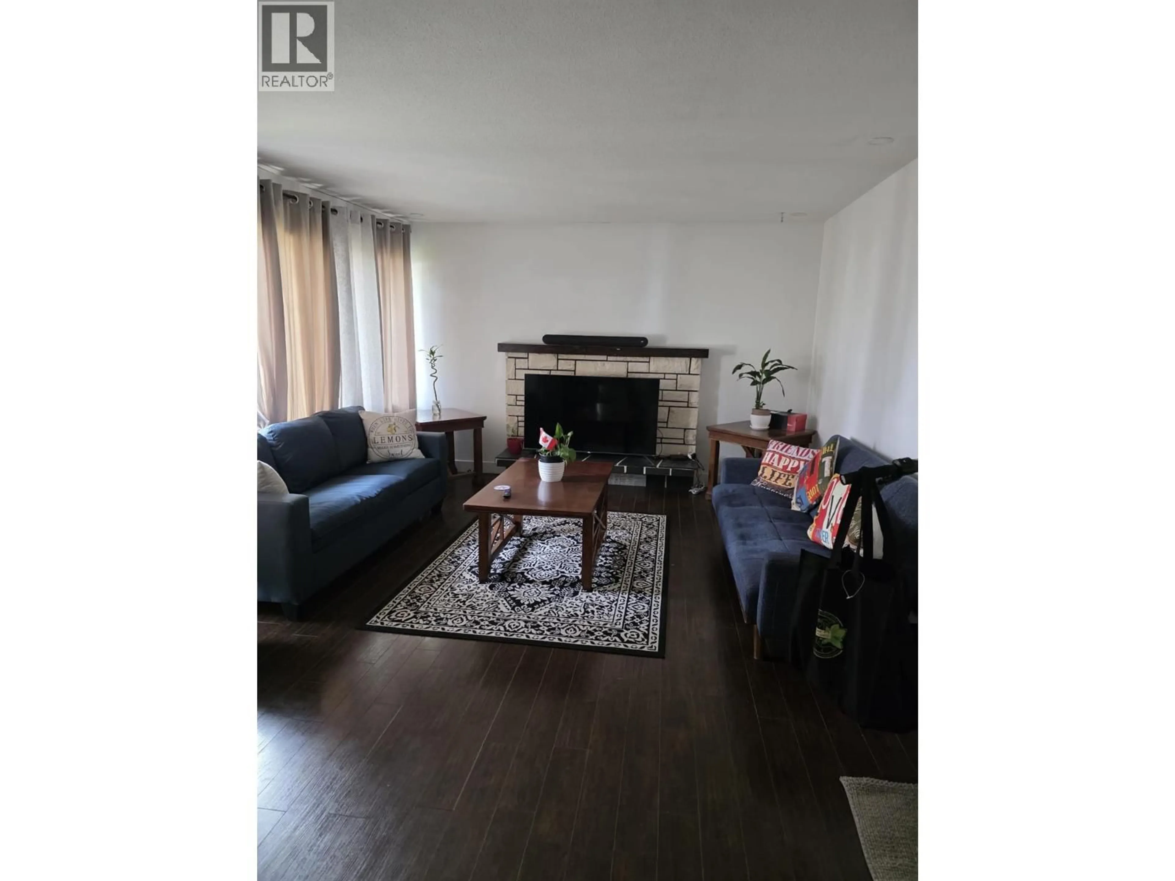 Living room with furniture, wood/laminate floor for 142 CURLEW PLACE, Kamloops British Columbia V2C4J1