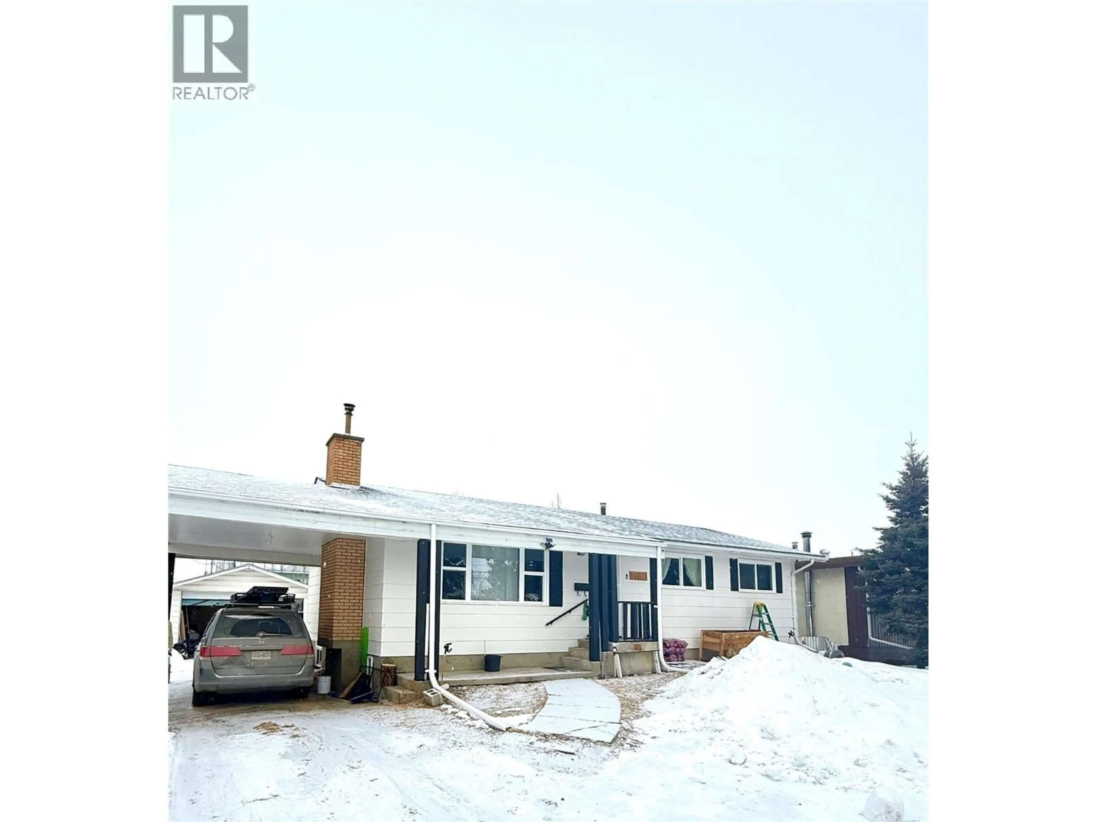 A pic from outside/outdoor area/front of a property/back of a property/a pic from drone, street for 1920 108 AVENUE, Dawson Creek British Columbia V1G2T8
