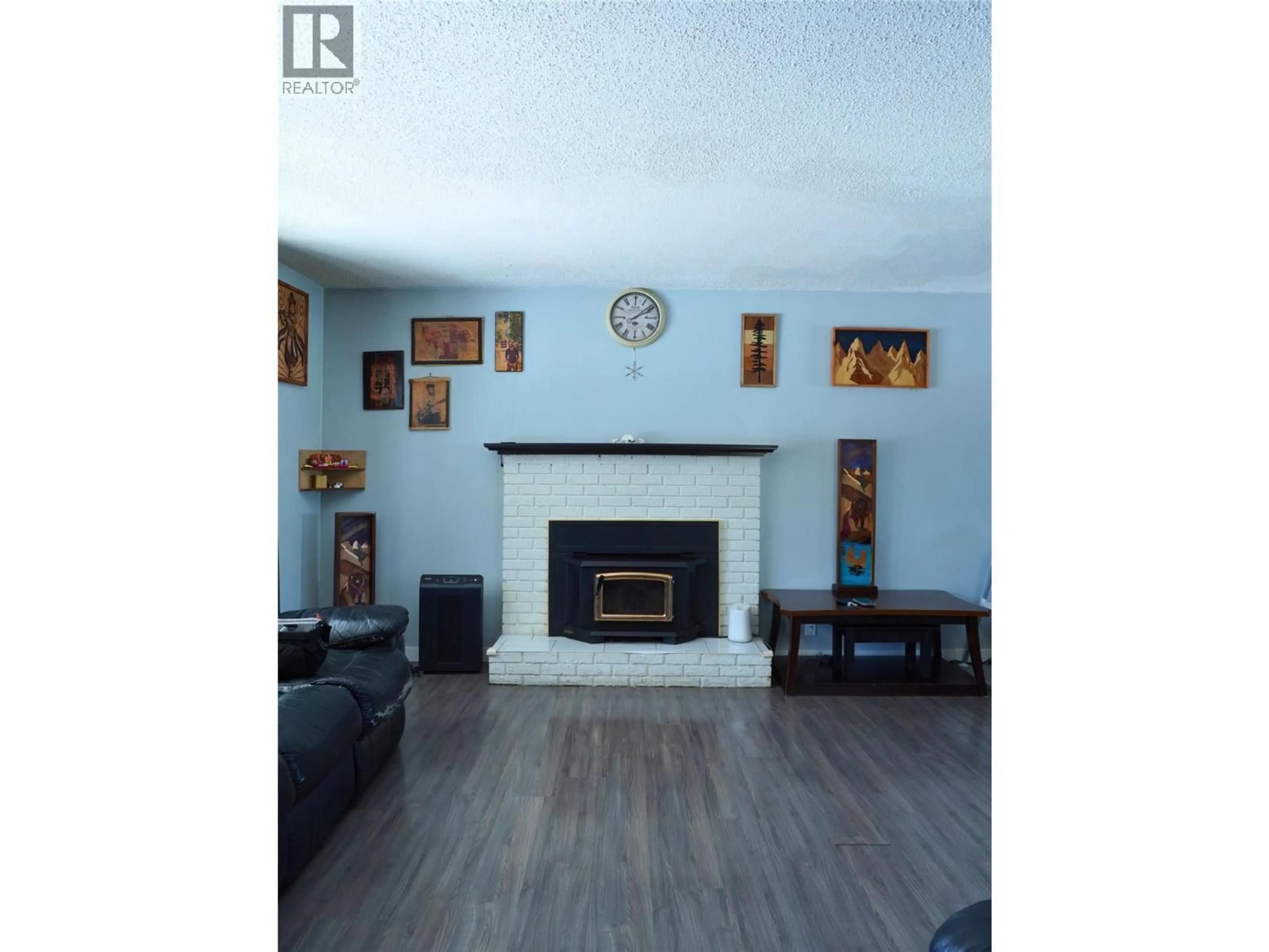 Living room with furniture, wood/laminate floor for 1920 108 AVENUE, Dawson Creek British Columbia V1G2T8