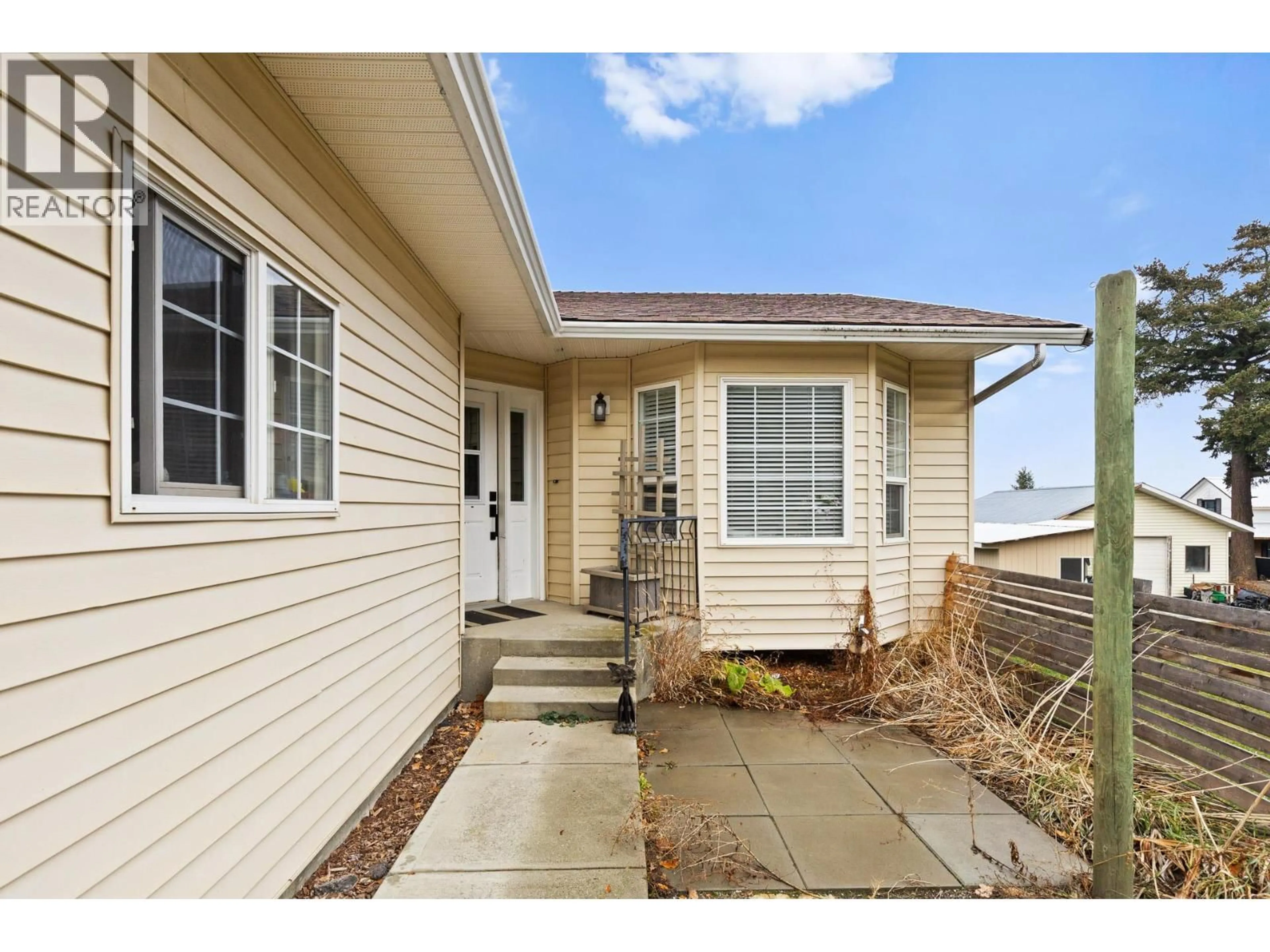 Home with vinyl exterior material, street for 1541 EAGLE ROCK ROAD, Spallumcheen British Columbia V0E1B7