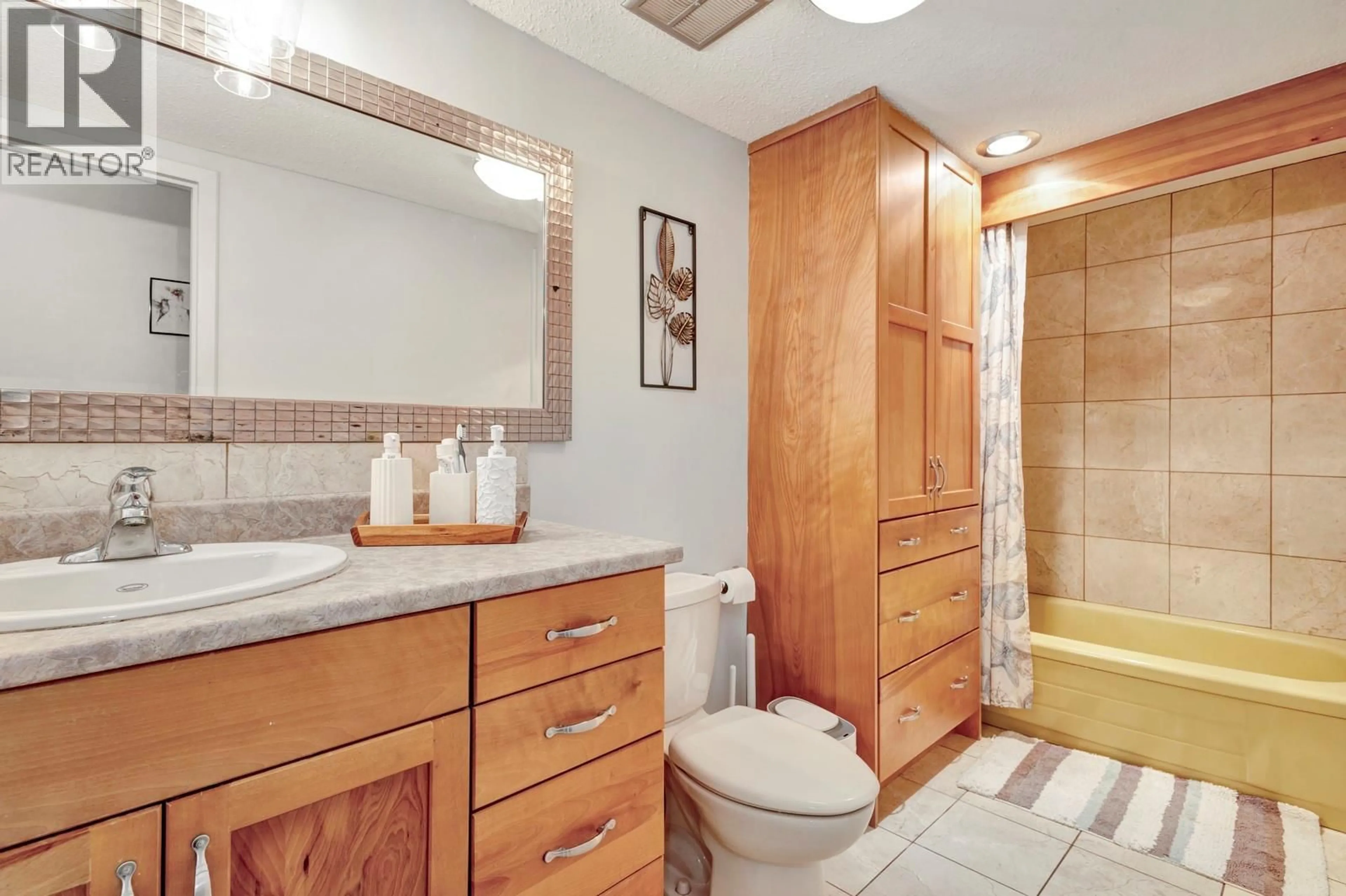 Standard bathroom, ceramic/tile floor for 104 - 445 ALL STAR COURT, Kelowna British Columbia V1X5N7