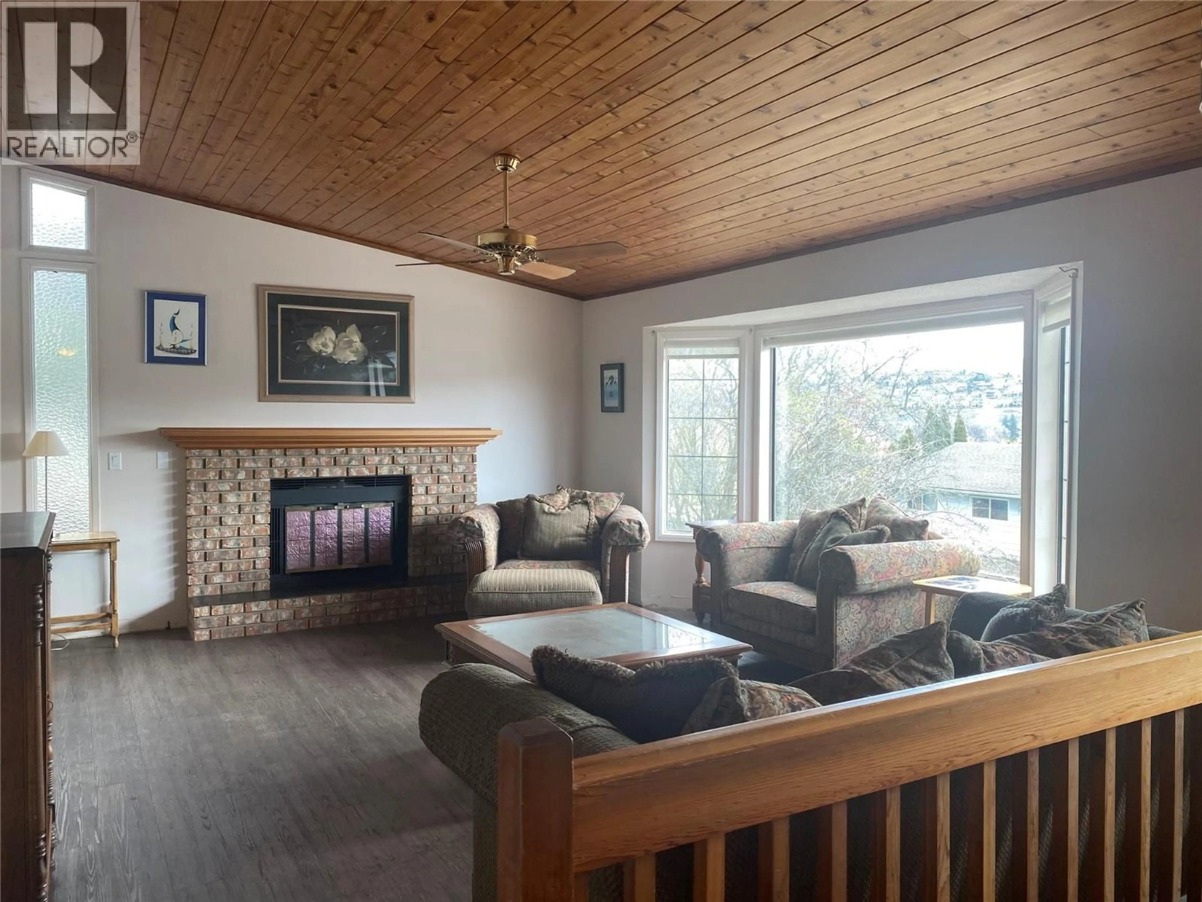 Living room with furniture, wood/laminate floor for 2900 PROSPECT DRIVE, Vernon British Columbia V1T8E4