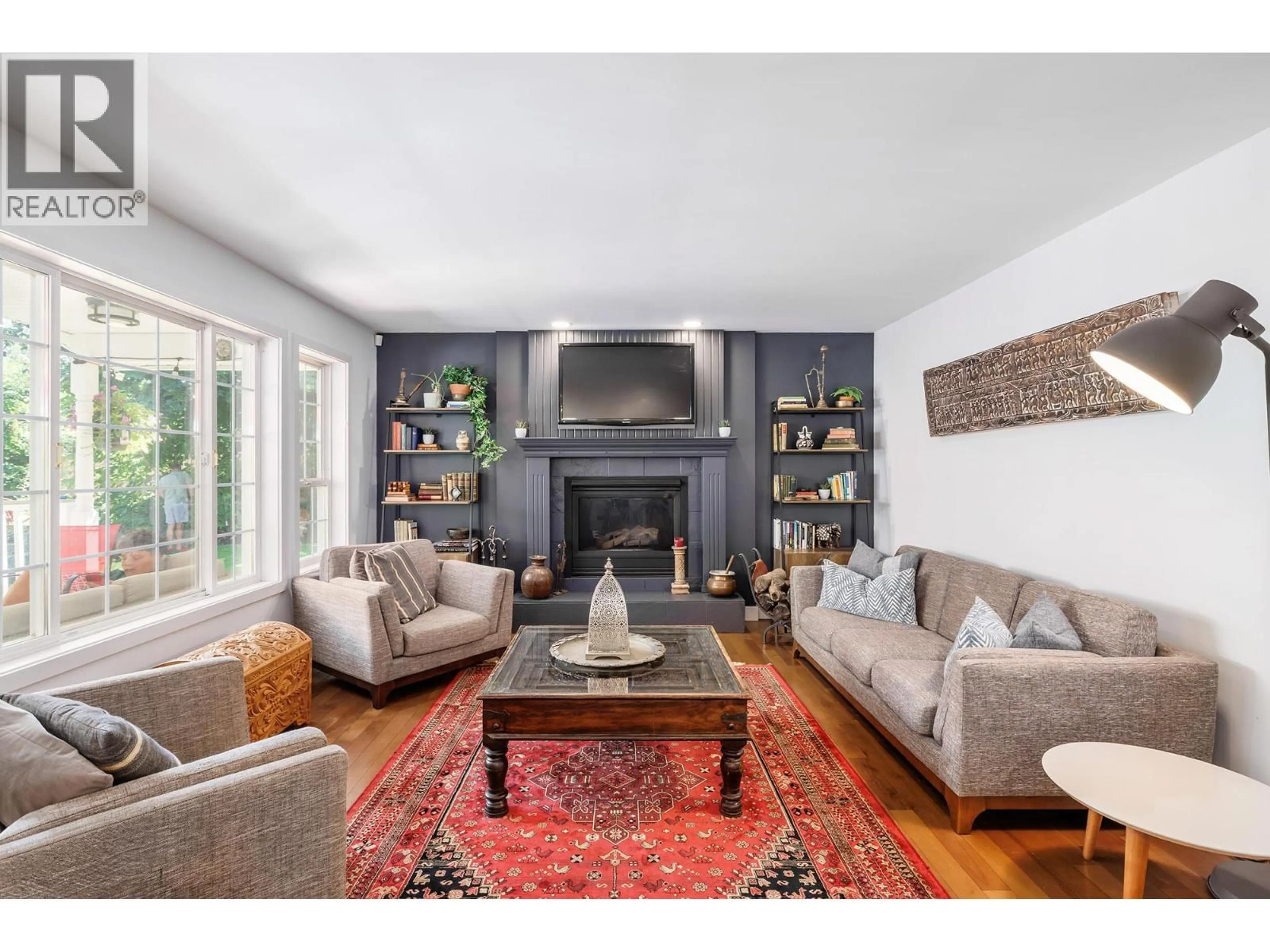 Living room with furniture, wood/laminate floor for 4551 HORAK ROAD, Kelowna British Columbia V1W1S1