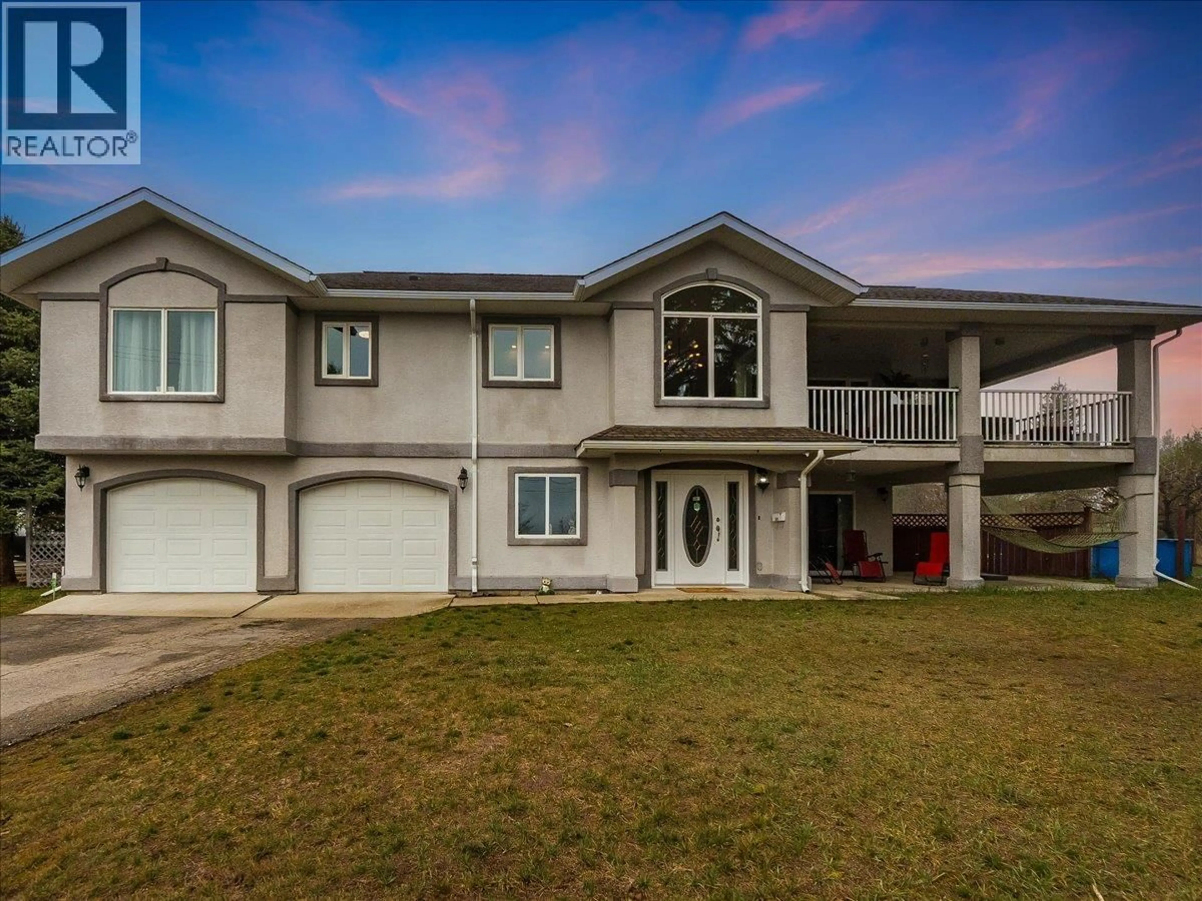 Home with vinyl exterior material, street for 601 12TH AVENUE, Genelle British Columbia V0G1G0