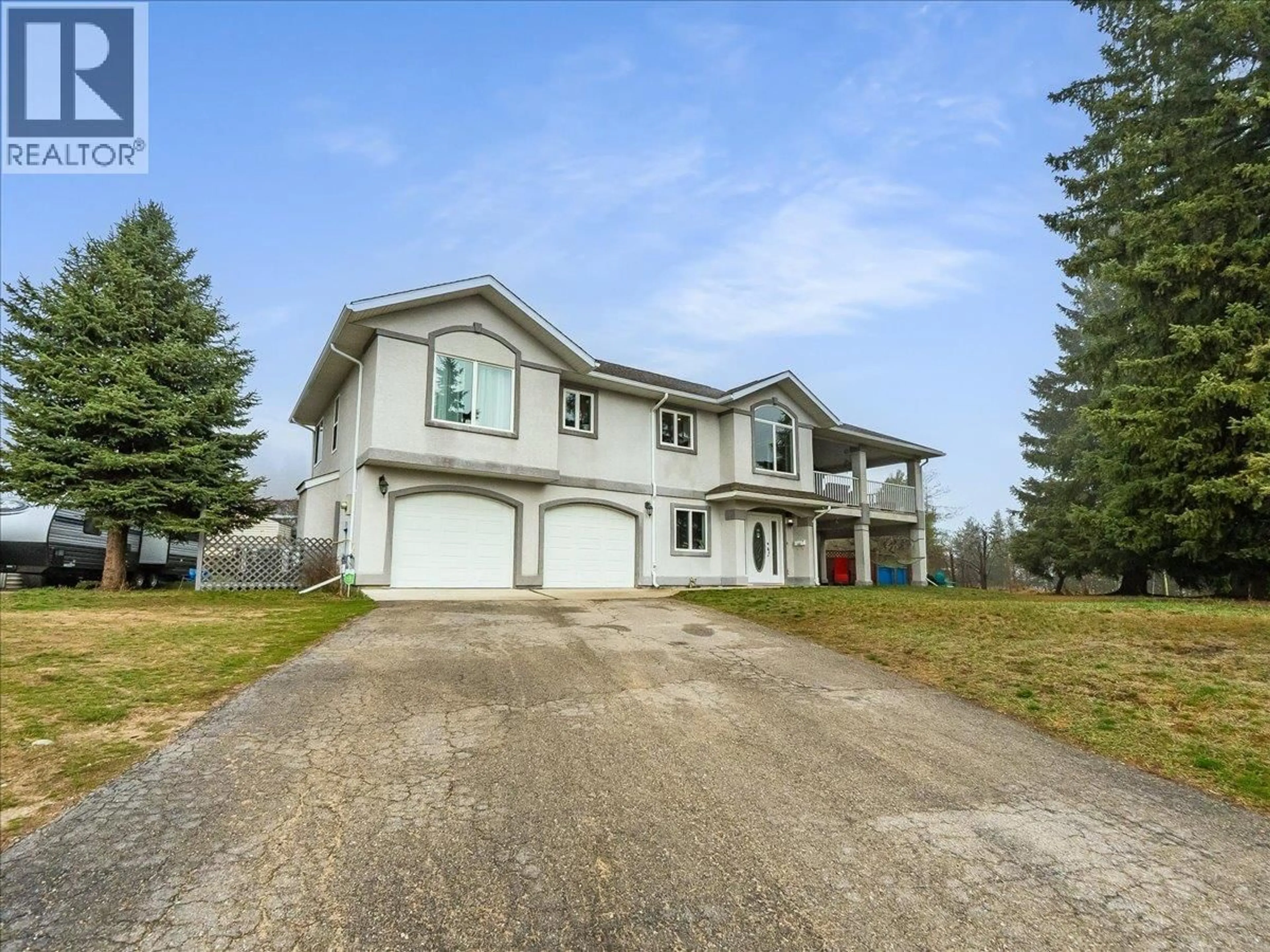 Home with vinyl exterior material, street for 601 12TH AVENUE, Genelle British Columbia V0G1G0