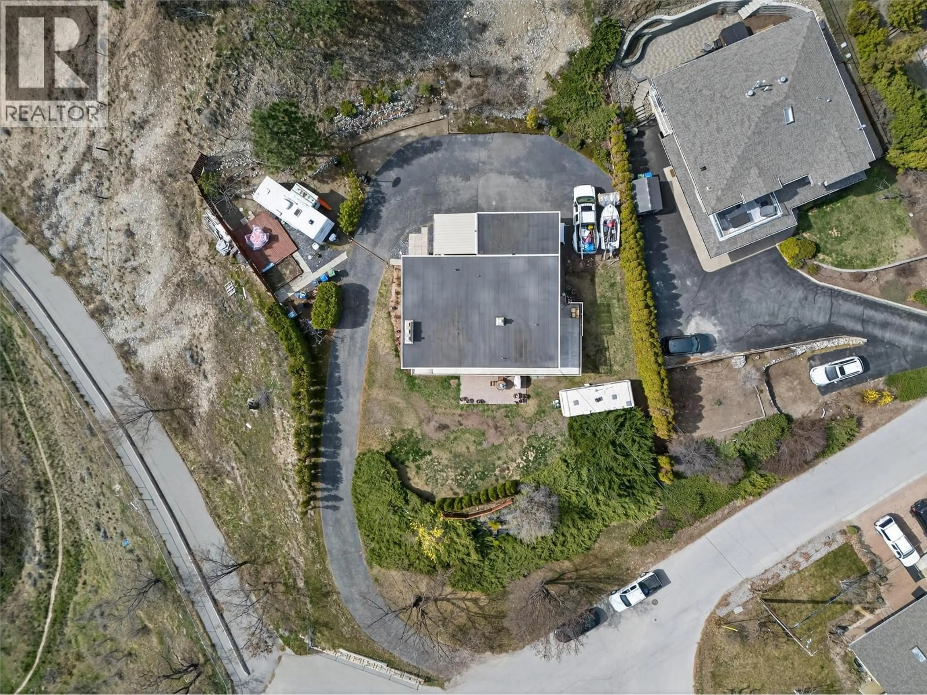 A pic from outside/outdoor area/front of a property/back of a property/a pic from drone, street for 13006 BRISTOW ROAD, Summerland British Columbia V0H1Z1