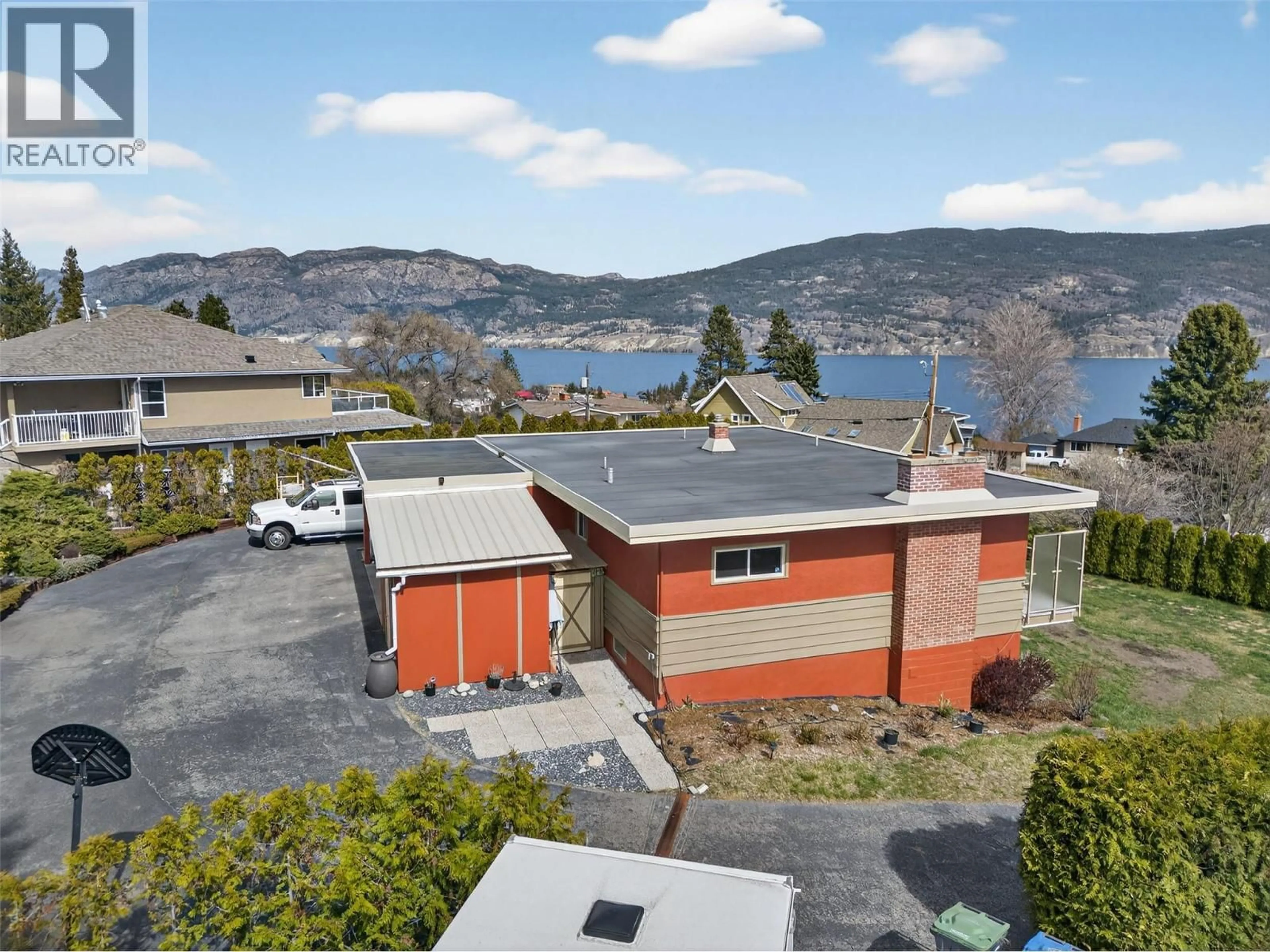 A pic from outside/outdoor area/front of a property/back of a property/a pic from drone, water/lake/river/ocean view for 13006 BRISTOW ROAD, Summerland British Columbia V0H1Z1