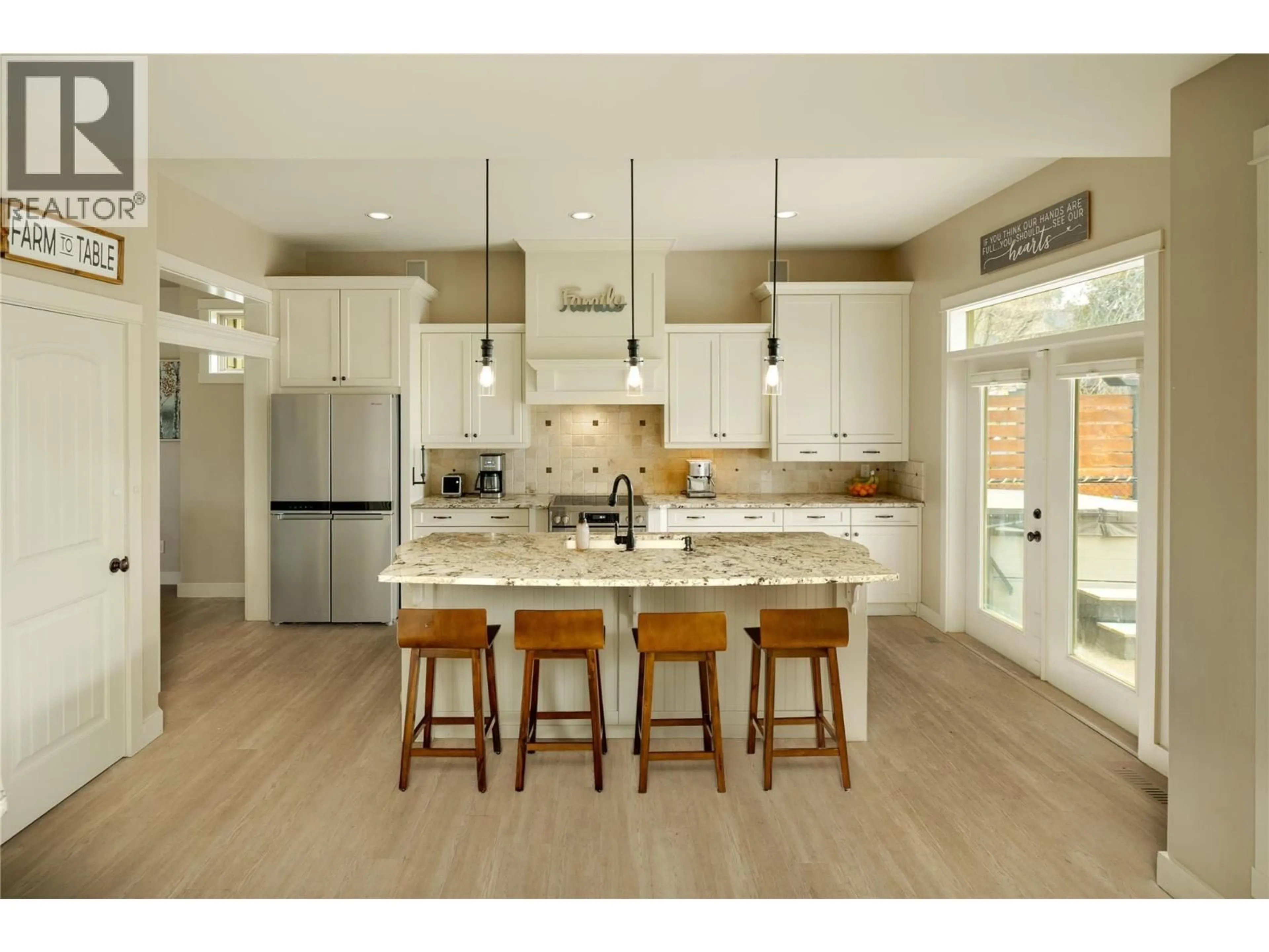 Open concept kitchen, wood/laminate floor for 1959 HIDDEN LAKE PLACE, Kelowna British Columbia V1V2W8