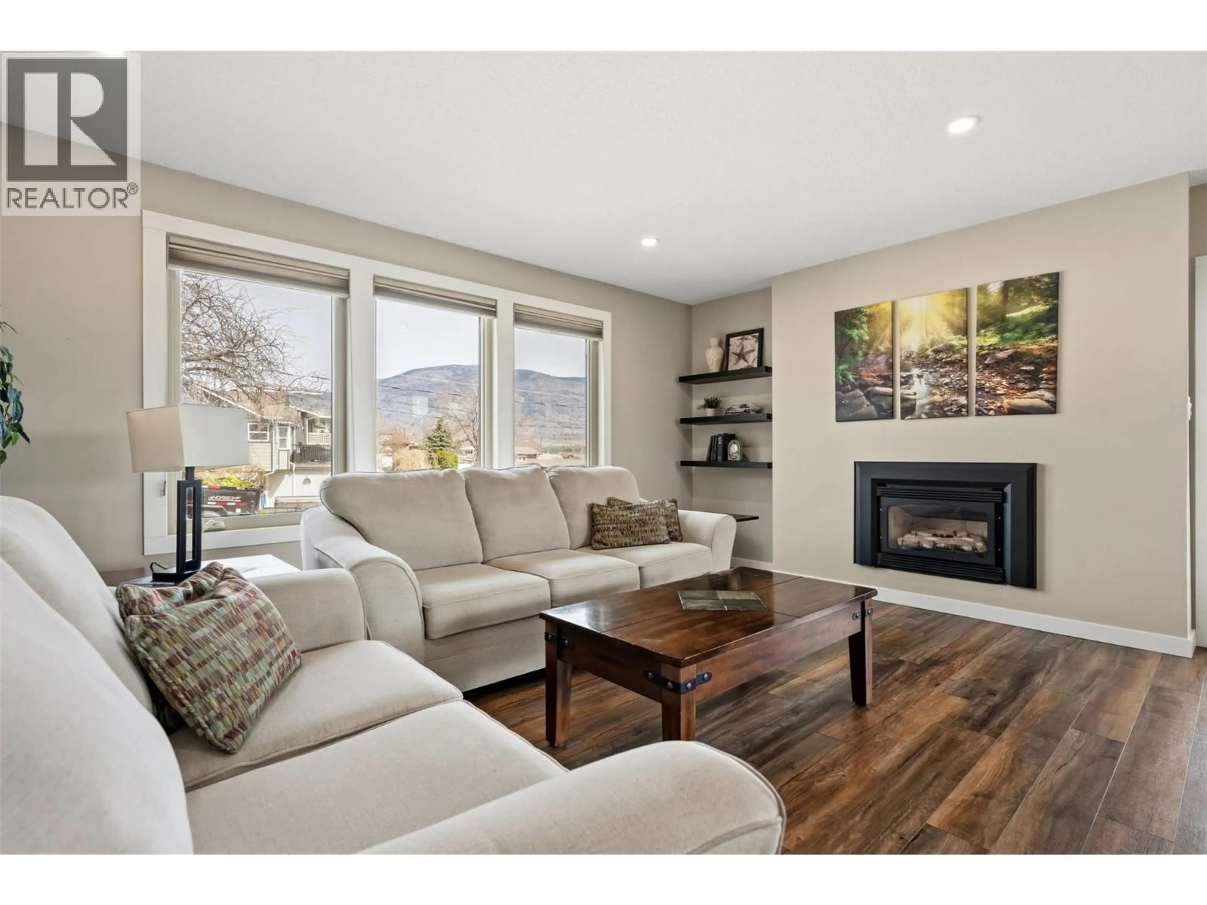 Living room with furniture, wood/laminate floor for 787 KETTLE AVENUE, Oliver British Columbia V0H1T0