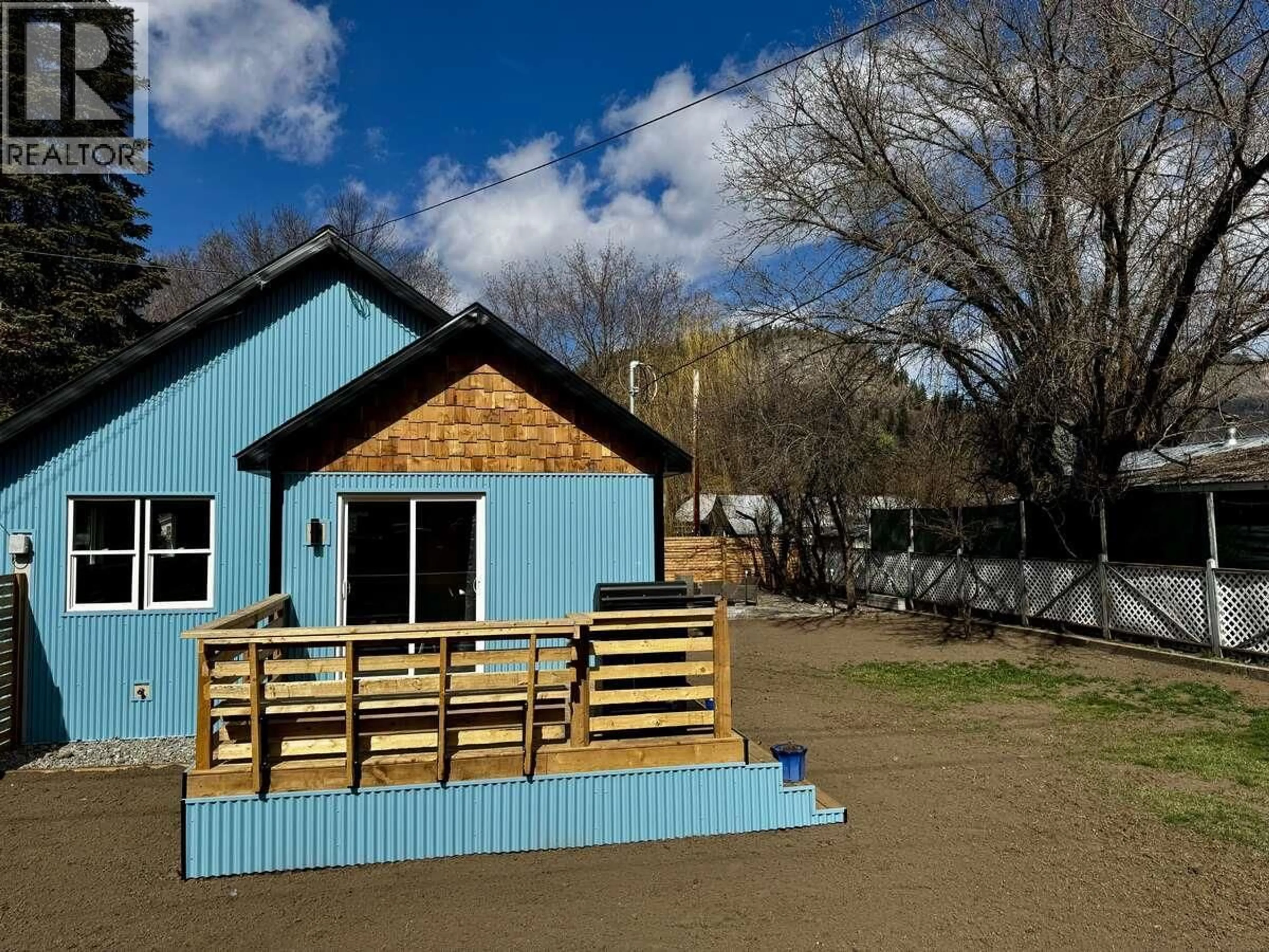 A pic from outside/outdoor area/front of a property/back of a property/a pic from drone, unknown for 987 KETTLE RIVER DRIVE, Grand Forks British Columbia V0H1H0