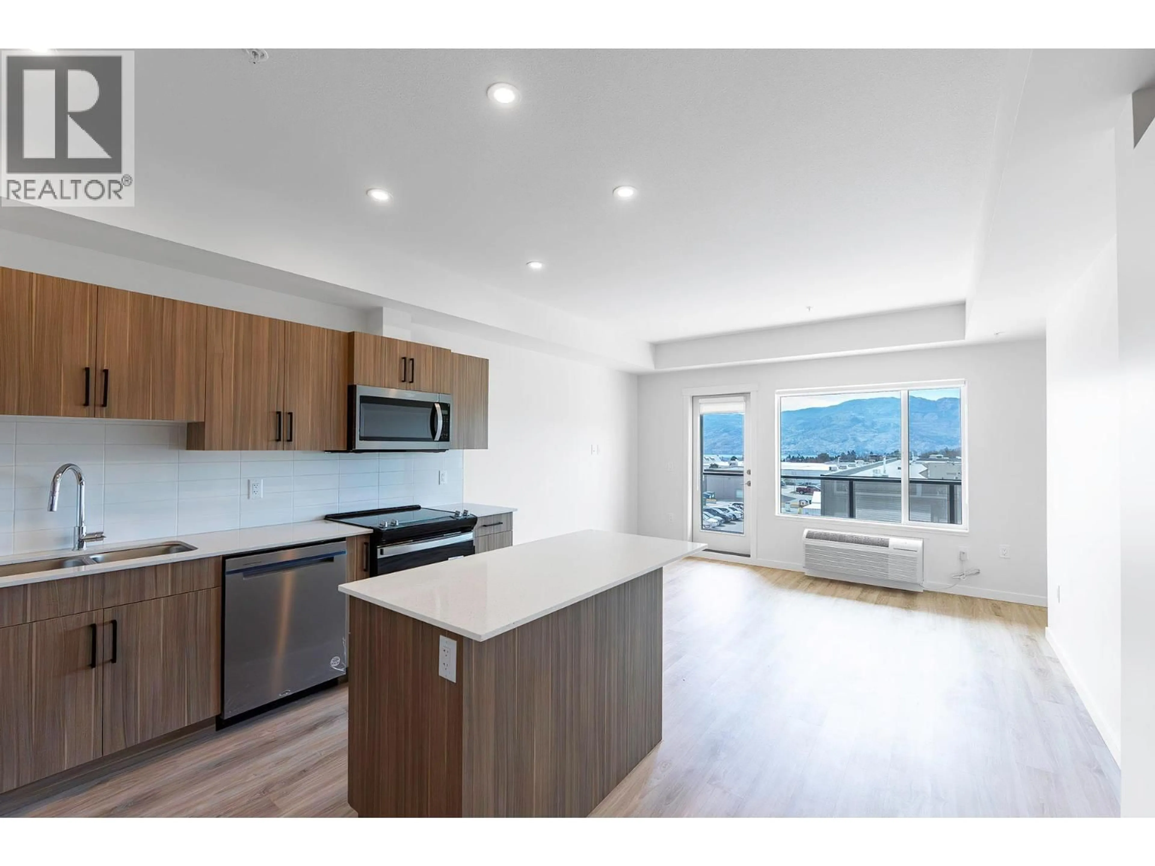 Open concept kitchen, wood/laminate floor for 318 - 2345 BUTT ROAD, West Kelowna British Columbia V4T1N6