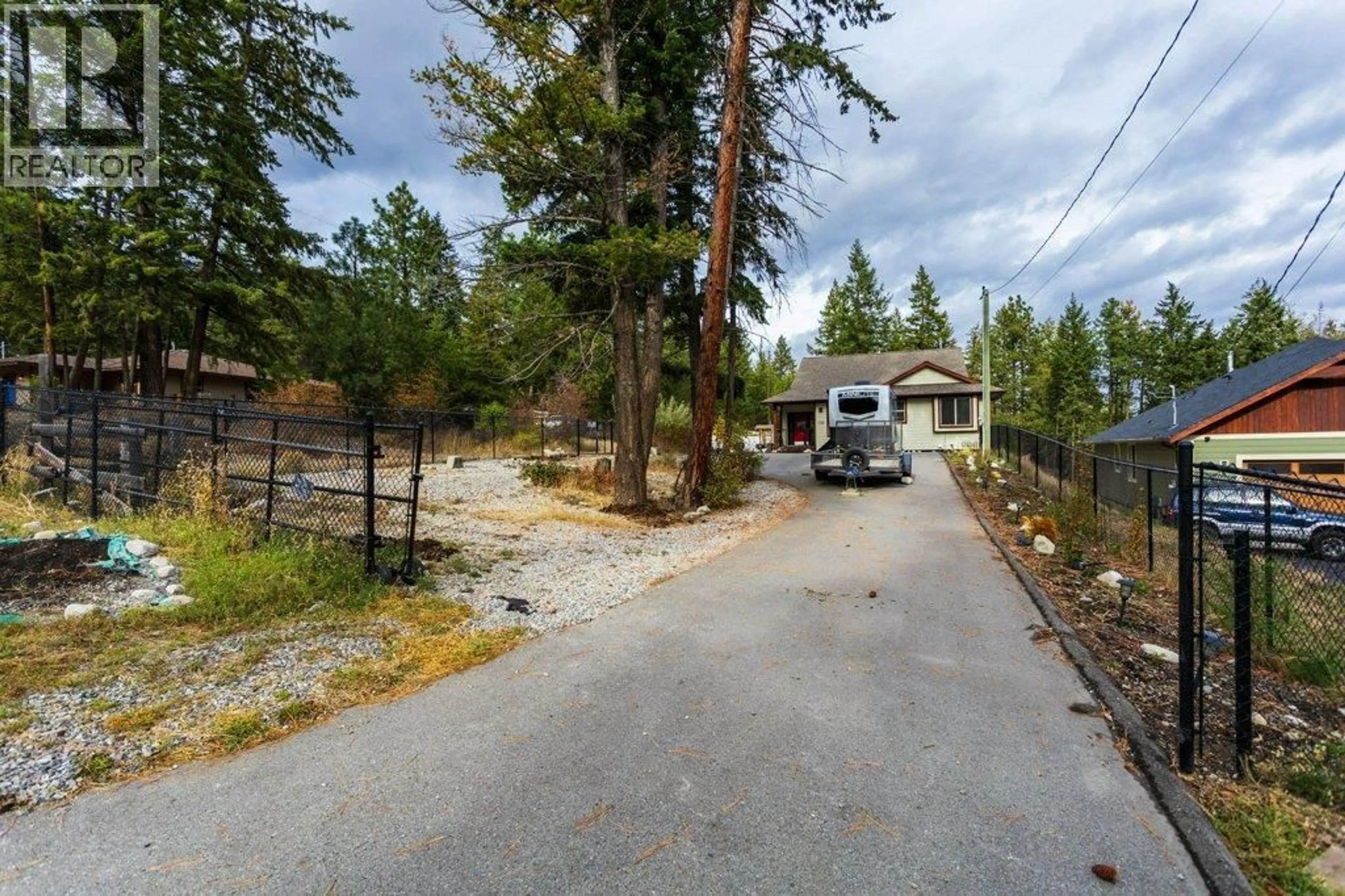 A pic from outside/outdoor area/front of a property/back of a property/a pic from drone, unknown for 750 FIRWOOD ROAD, Kelowna British Columbia V1Z3V5