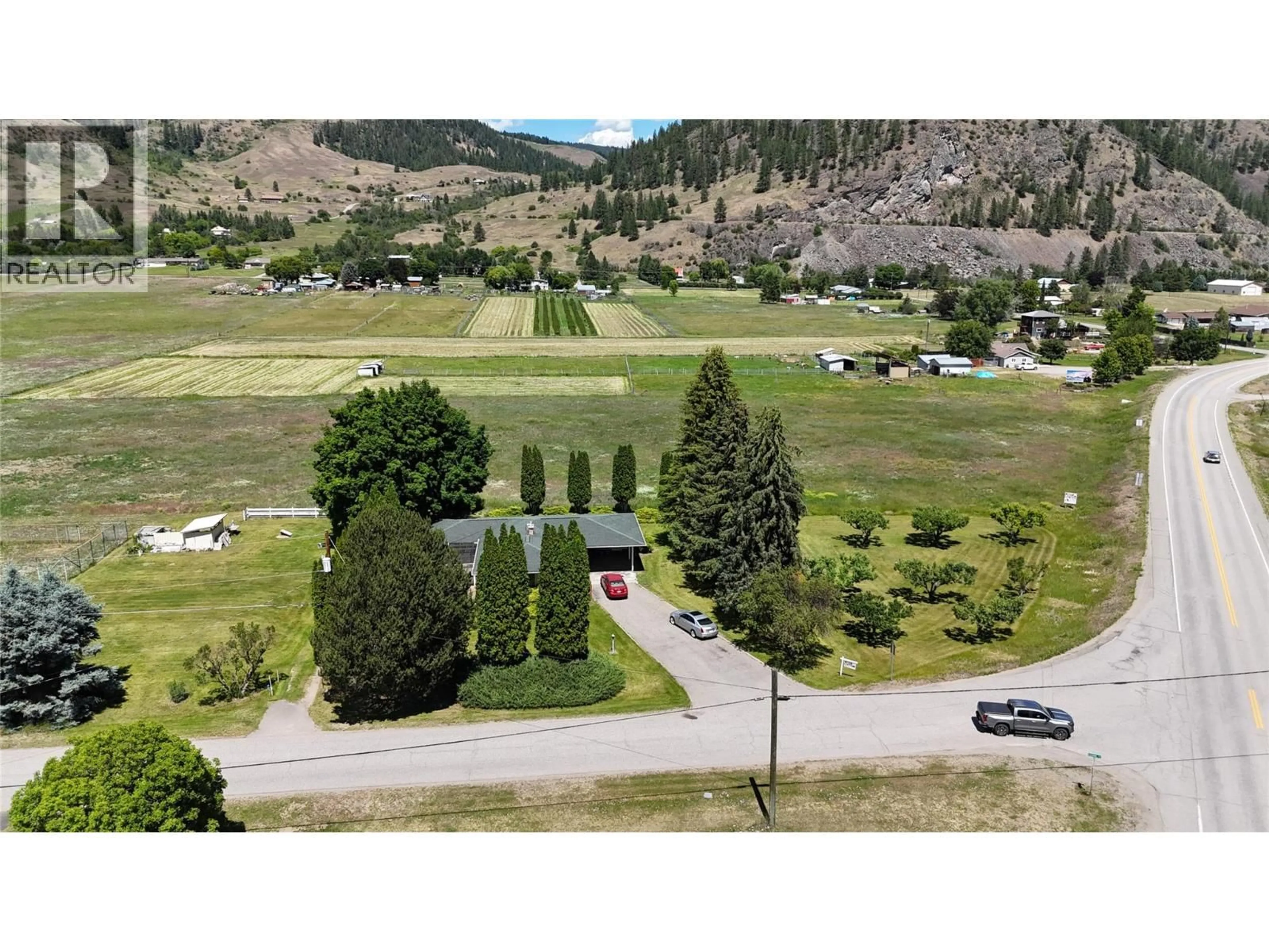 A pic from outside/outdoor area/front of a property/back of a property/a pic from drone, mountain view for 4065 CANNING ROAD, Grand Forks British Columbia V0H1H5