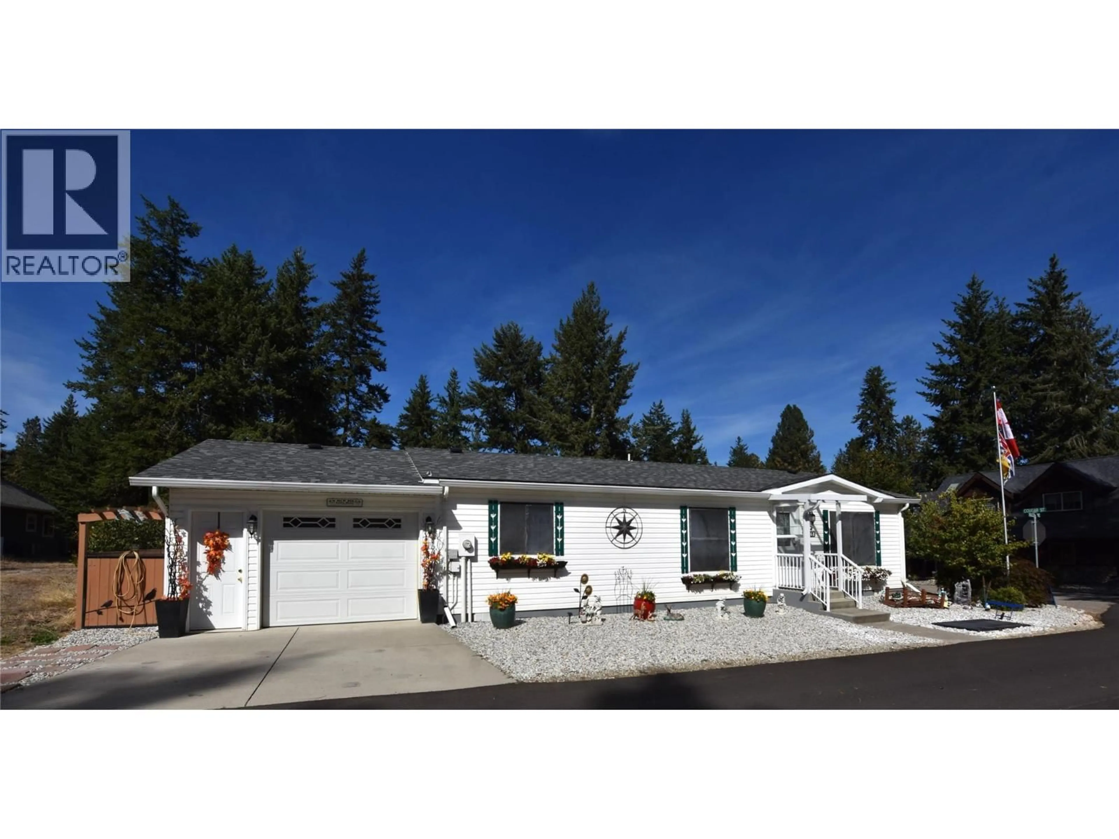 Home with vinyl exterior material, street for 223 COUGAR STREET, Vernon British Columbia V1H2A1